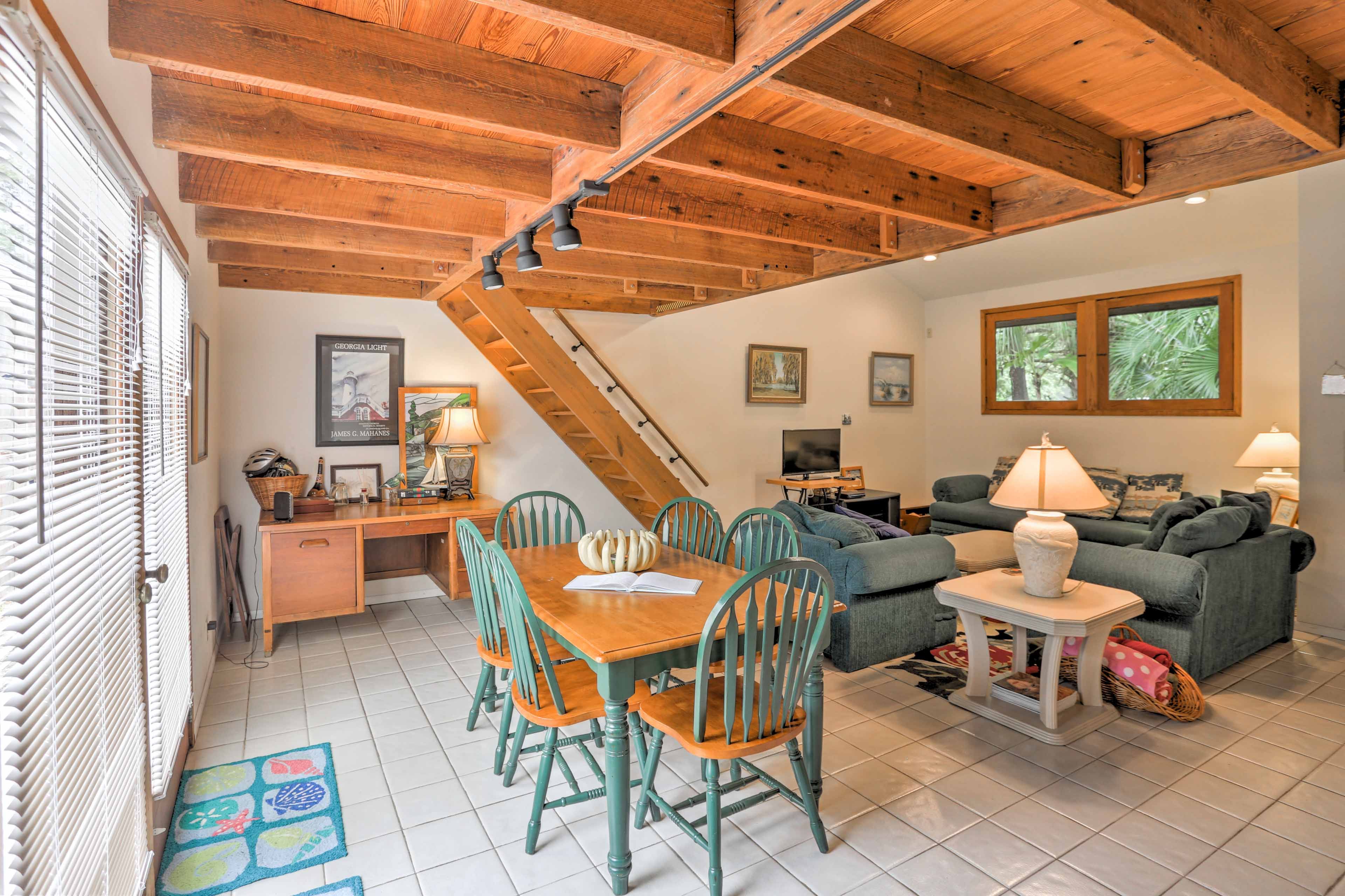 Natural light fills the living space highlighting rustic wood accents.