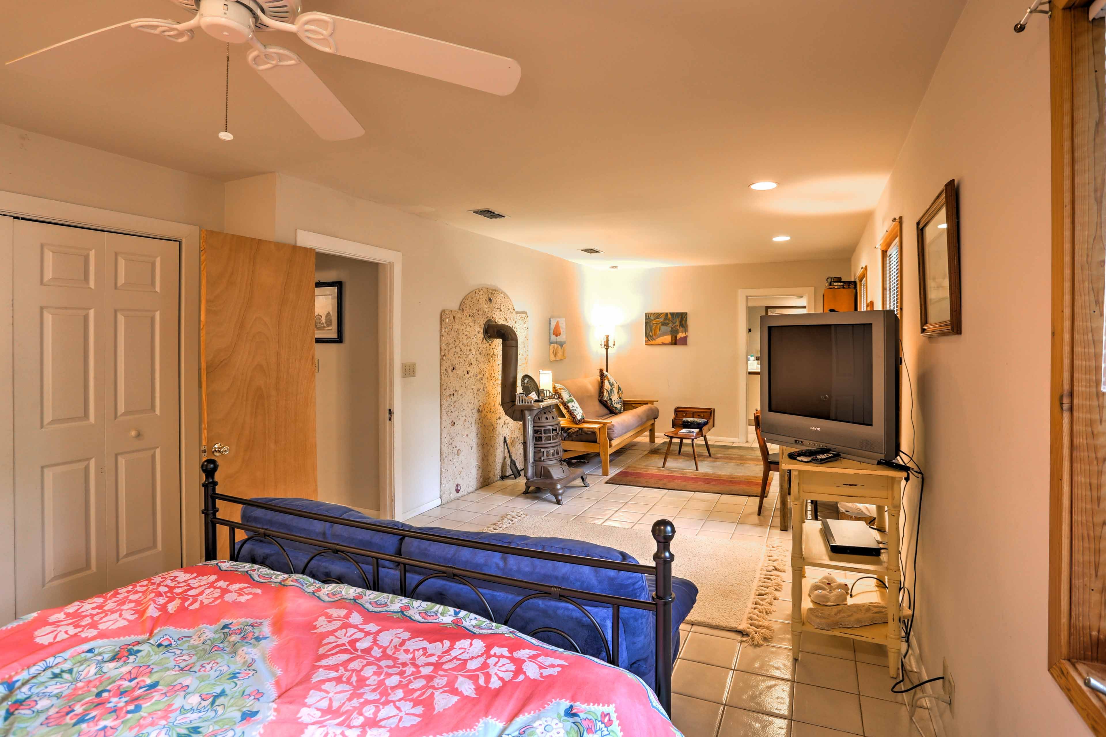 The spacious room also has a flat-screen TV, 2 sofas, and a desk.
