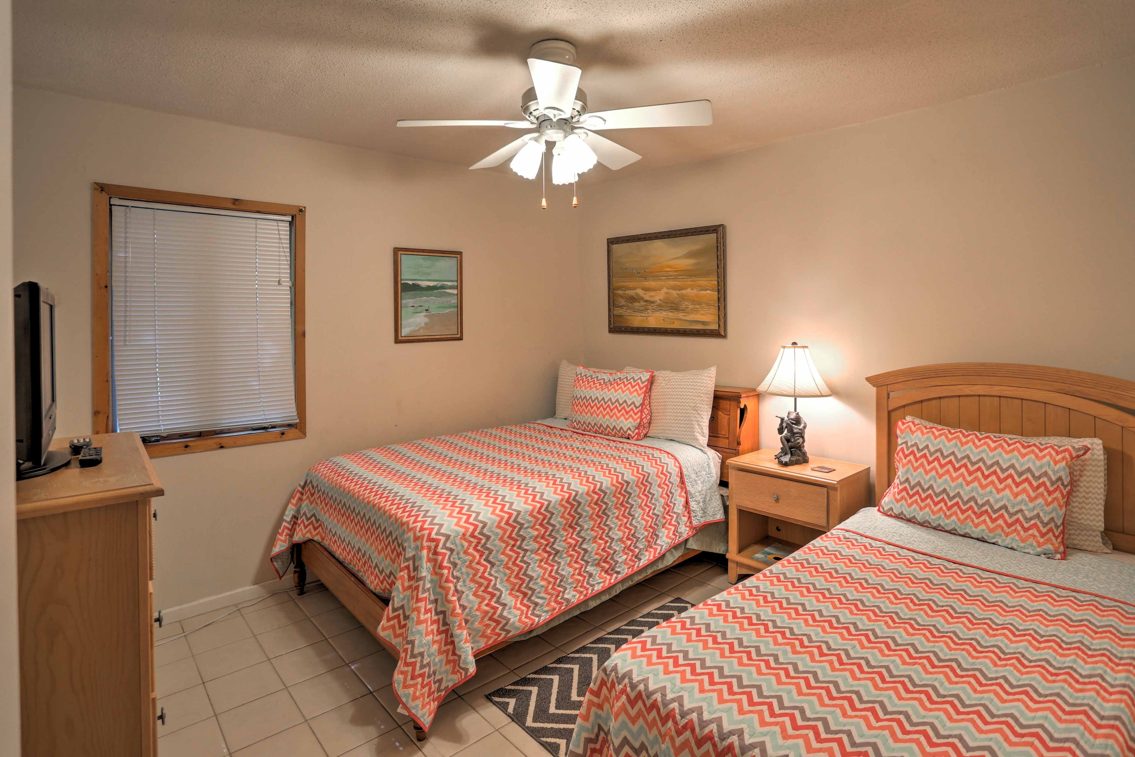 Kids will love the second bedroom with a twin bed, full bed, and flat-screen TV.
