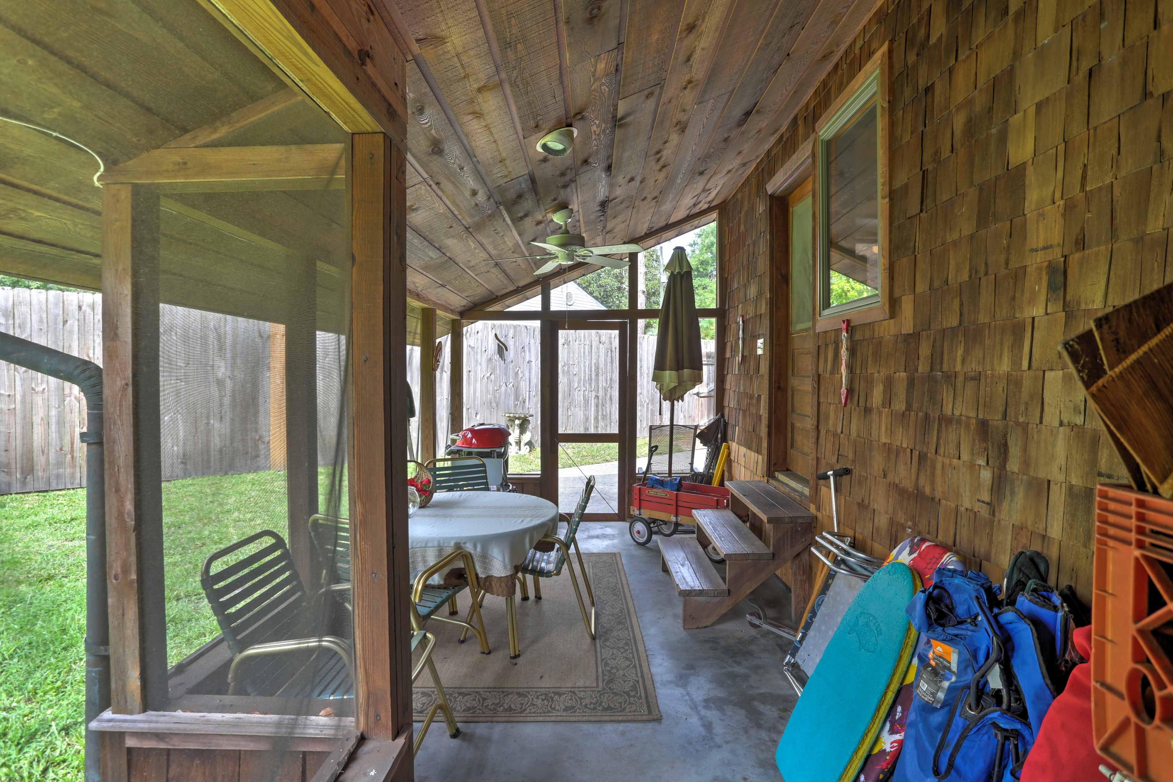 Relax to the fullest on the lovely screened-in patio.
