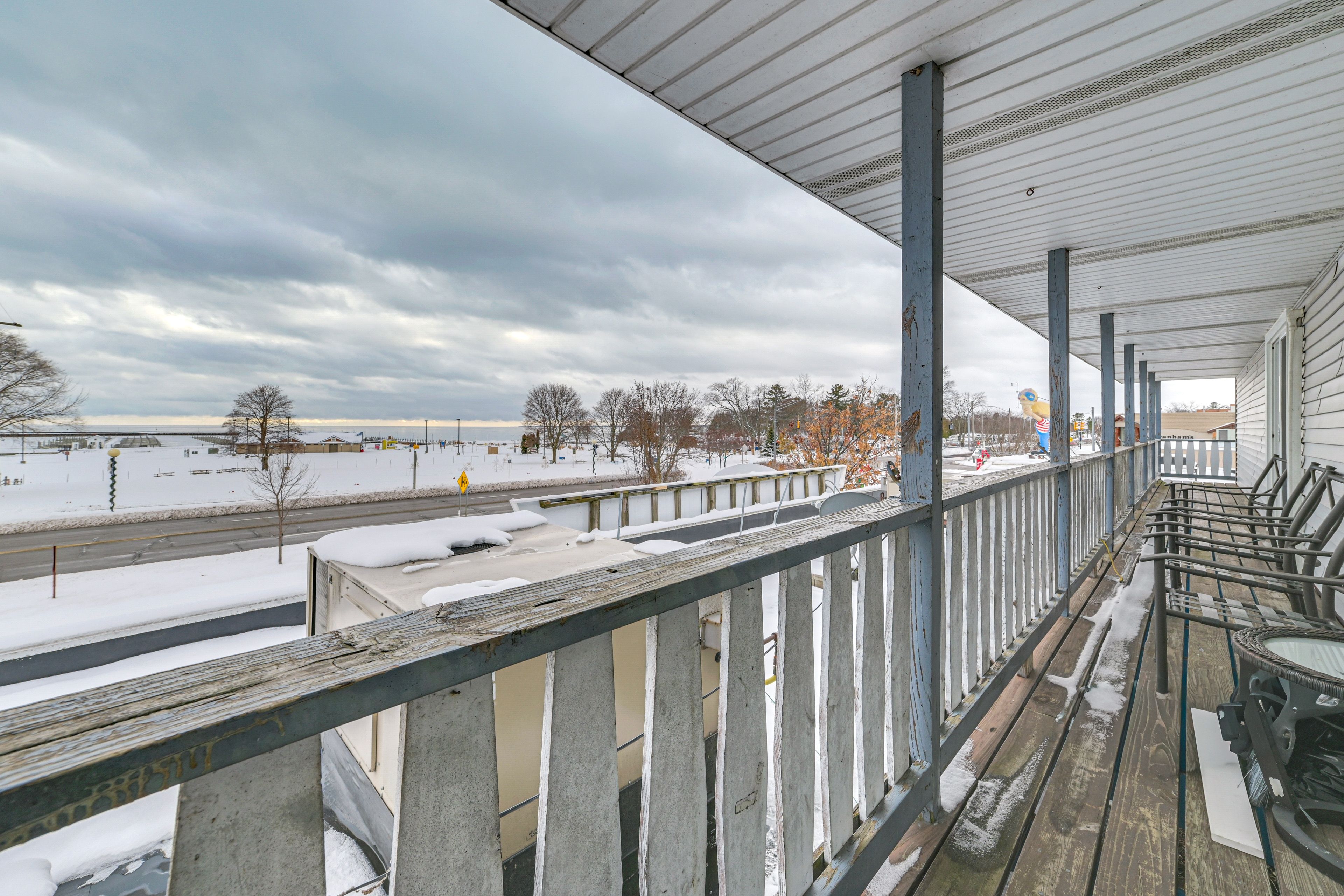 Covered Balcony | Gas Grill | Seating | Lake Views