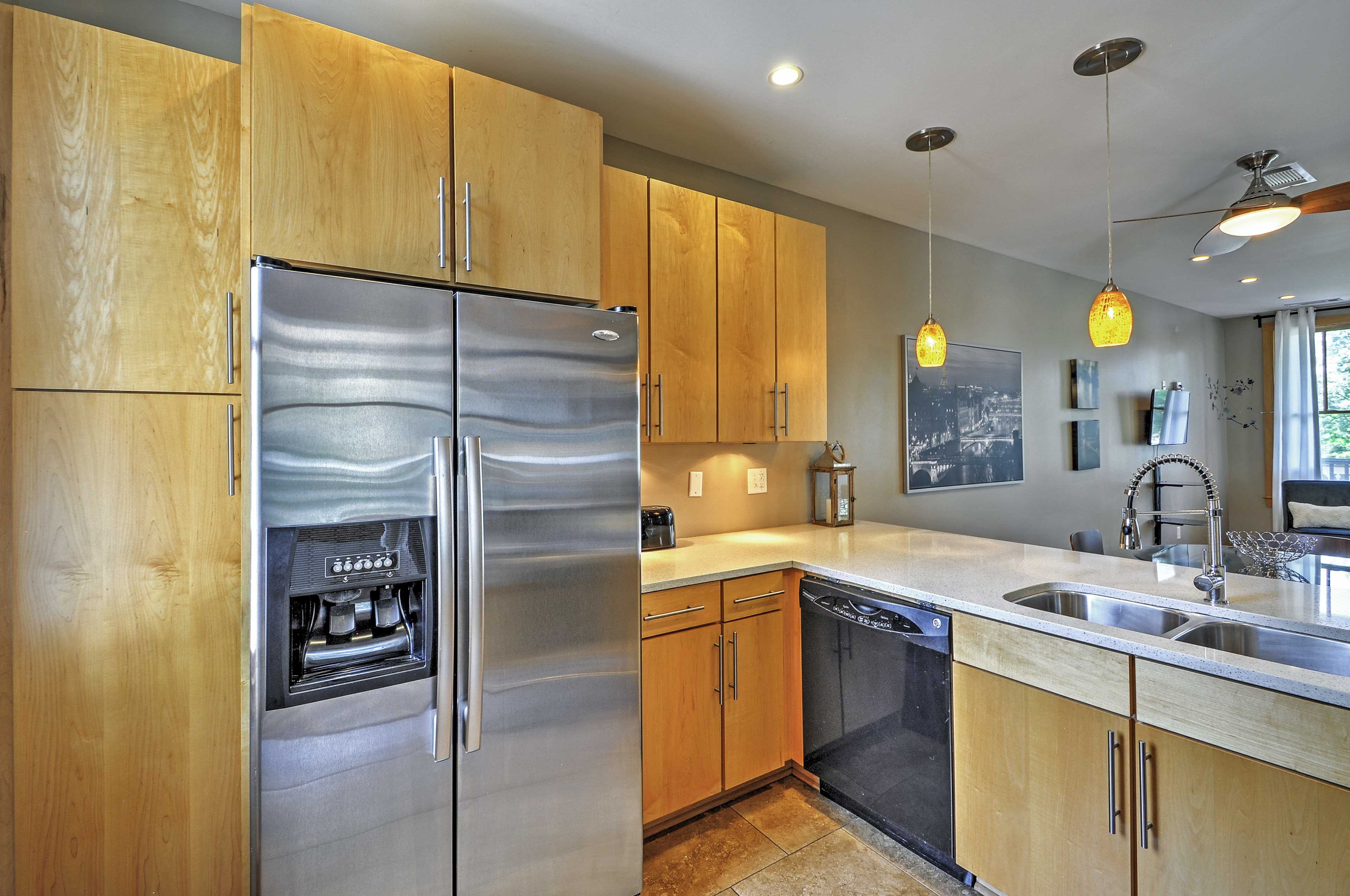 The kitchen is fully equipped with stainless steel appliances.