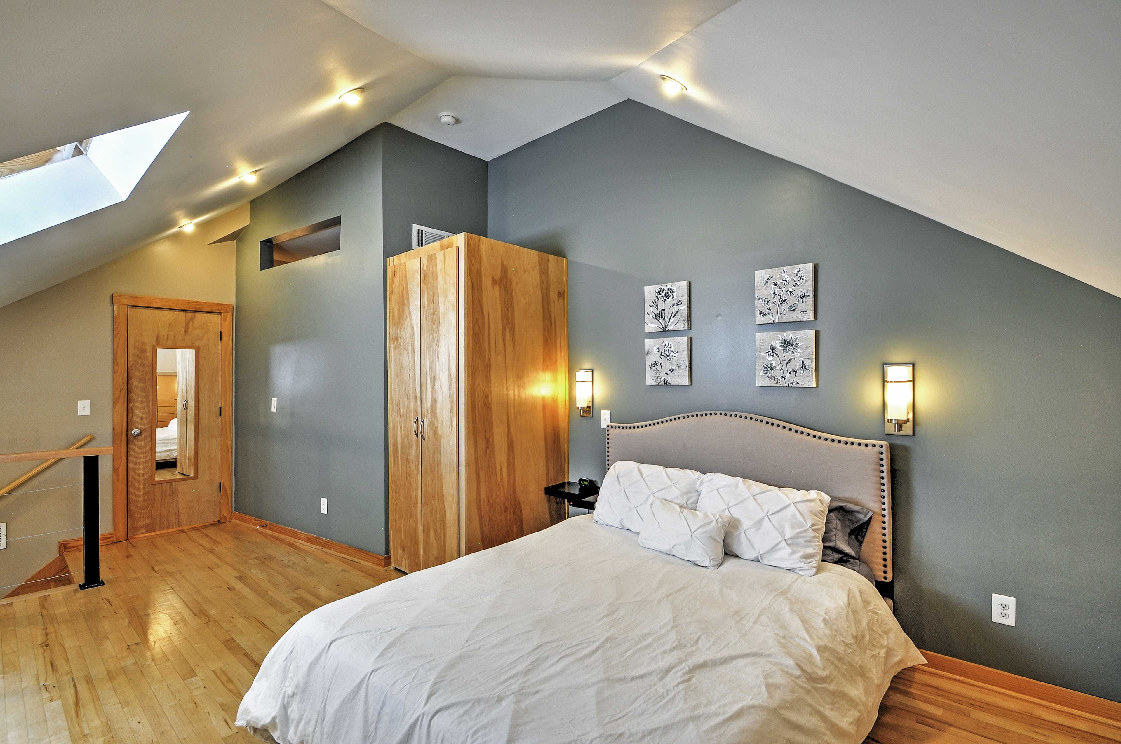 The loft features a cozy queen bed.