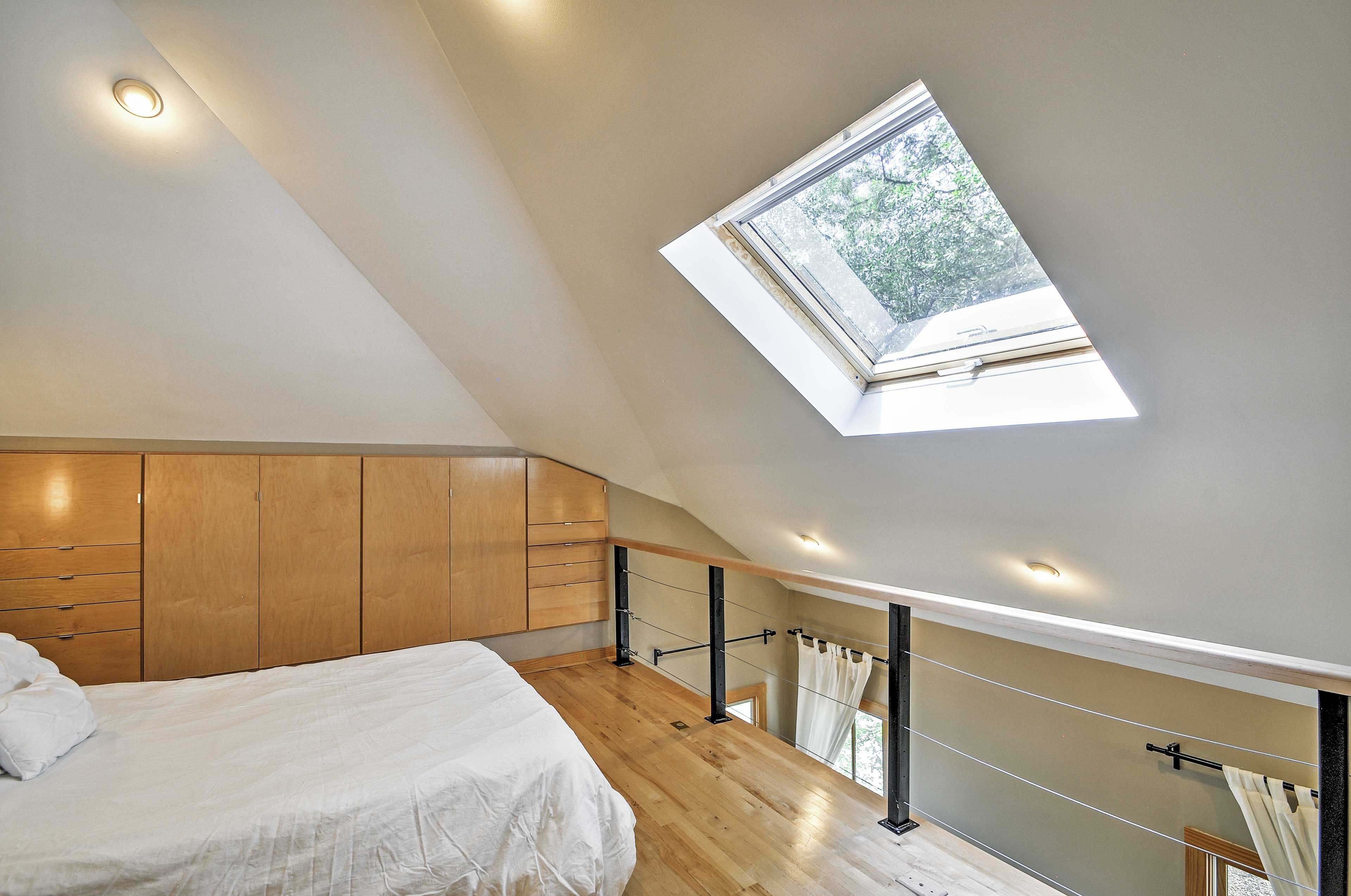A skylight lets you gaze out at the bright stars right from your bed.