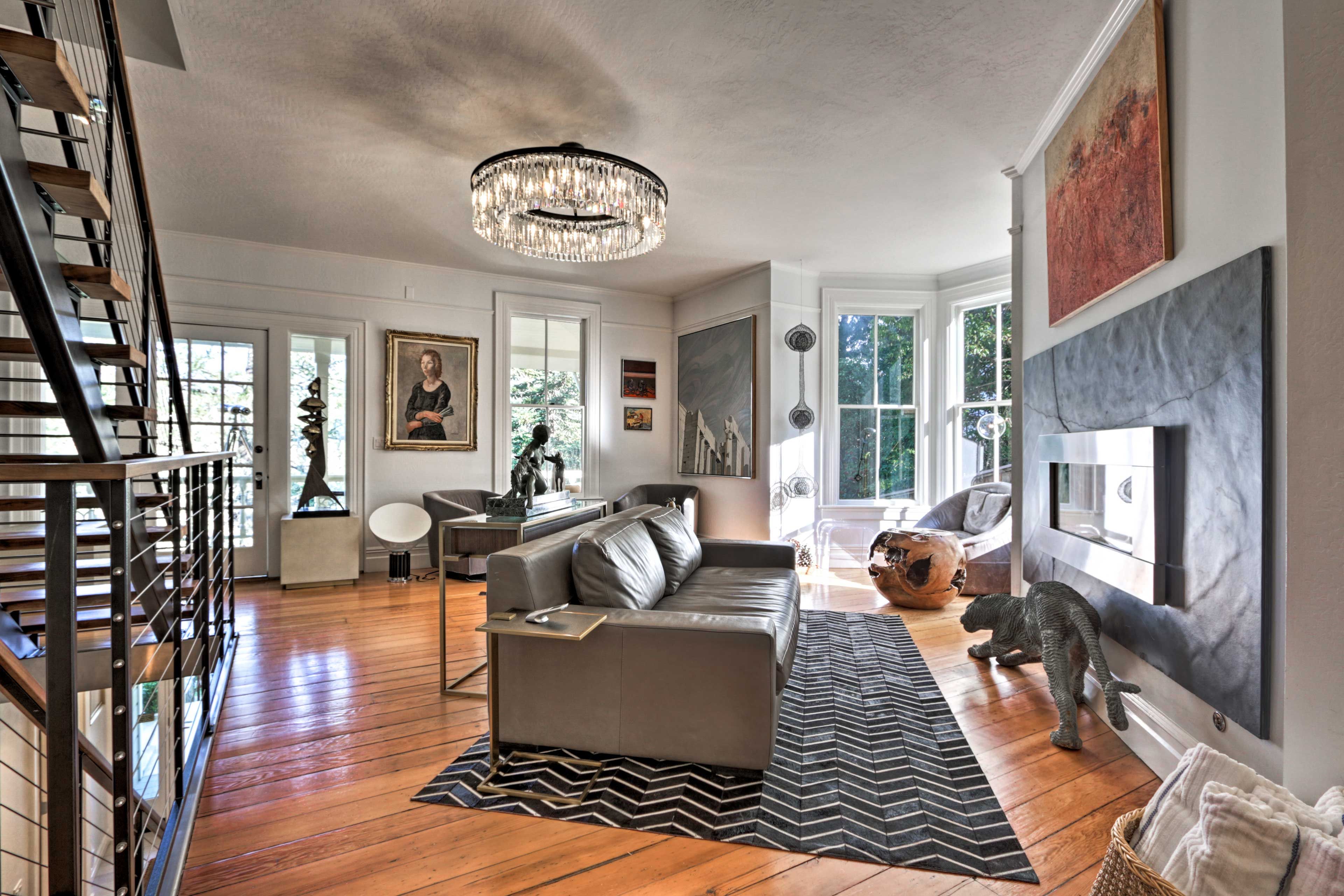 Hardwood flooring and ample natural light leads you from room to room.