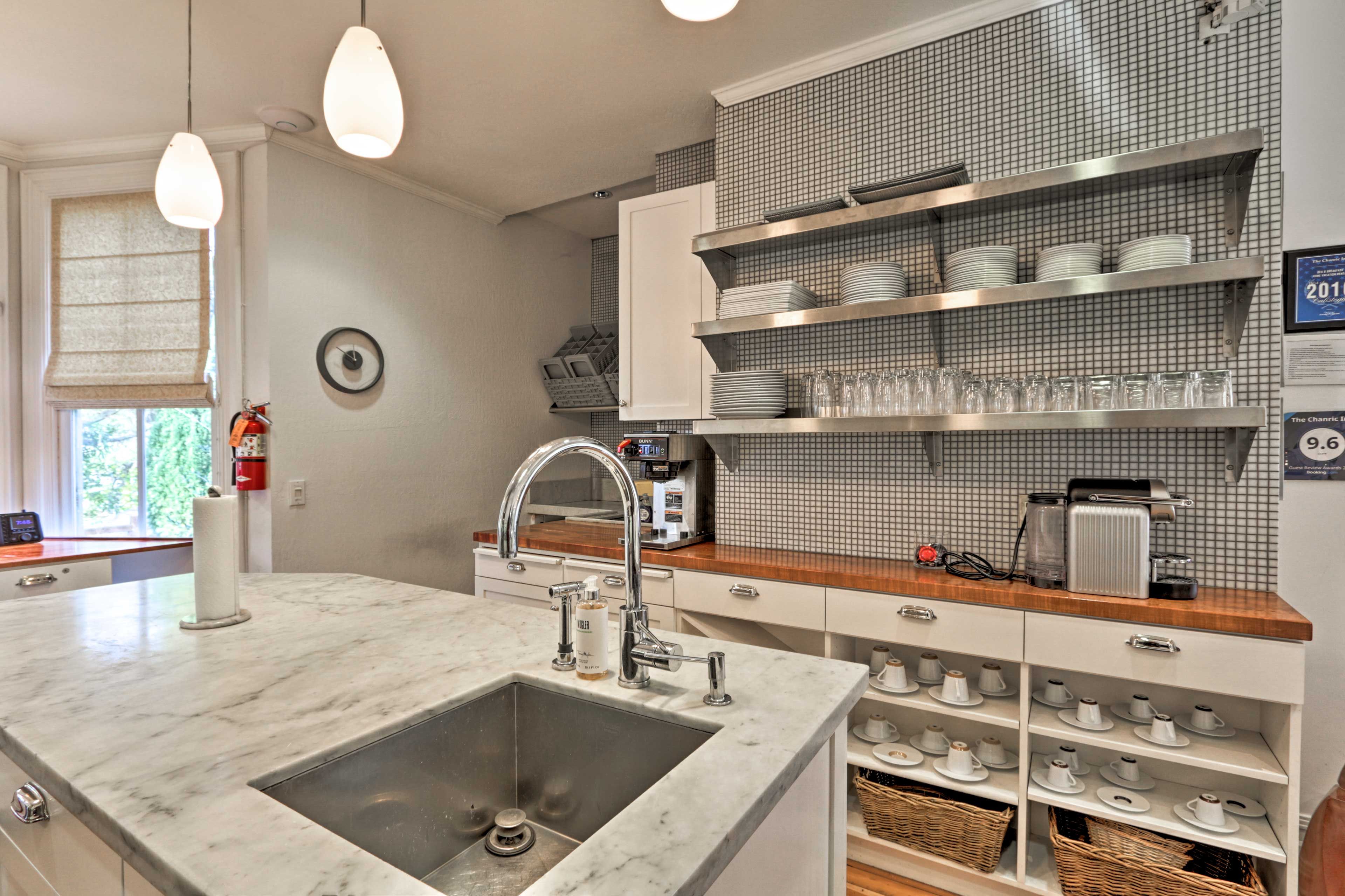 The lovely kitchen is fully equipped with stainless steel appliances.