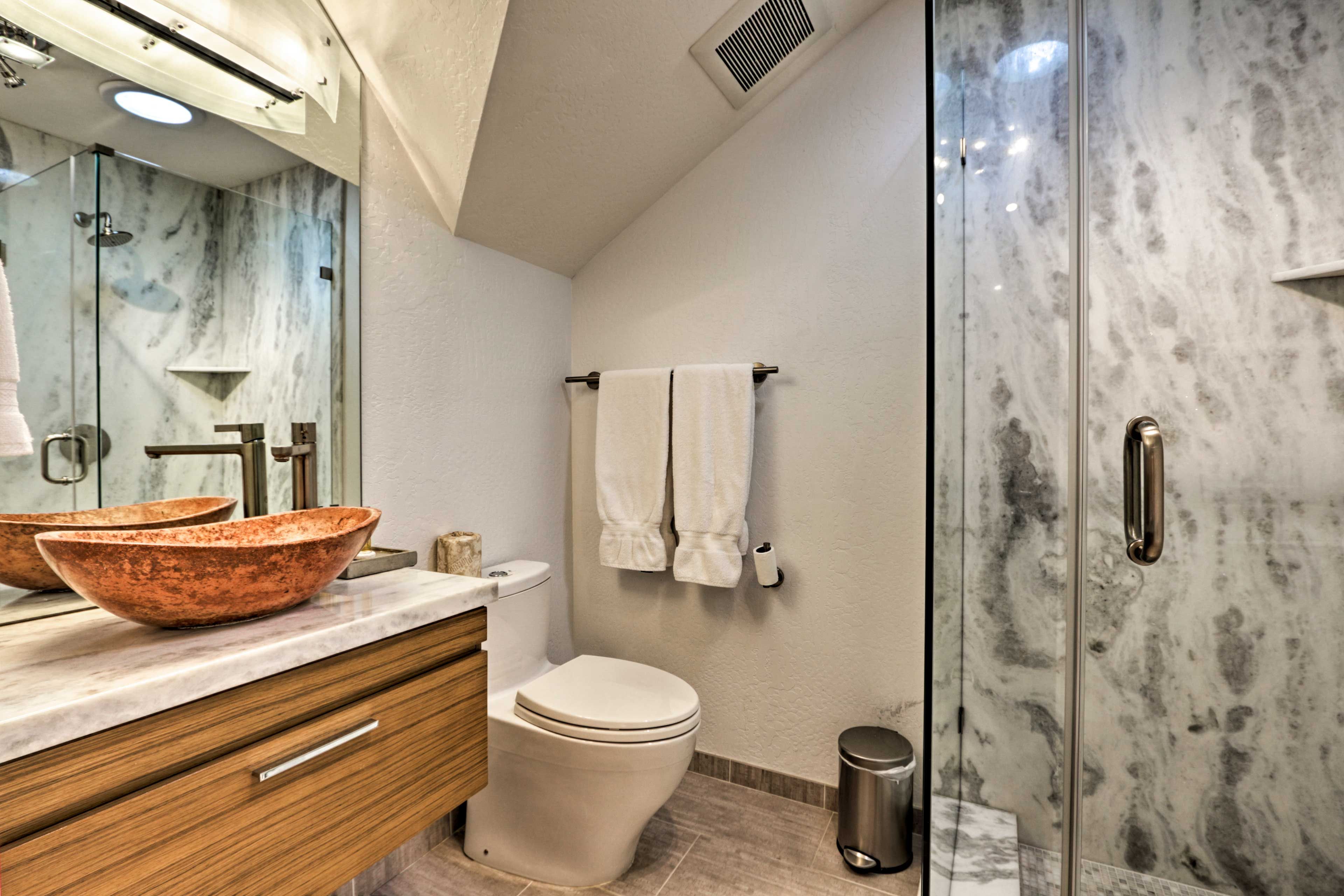 This pristine bathroom also includes a walk-in shower.