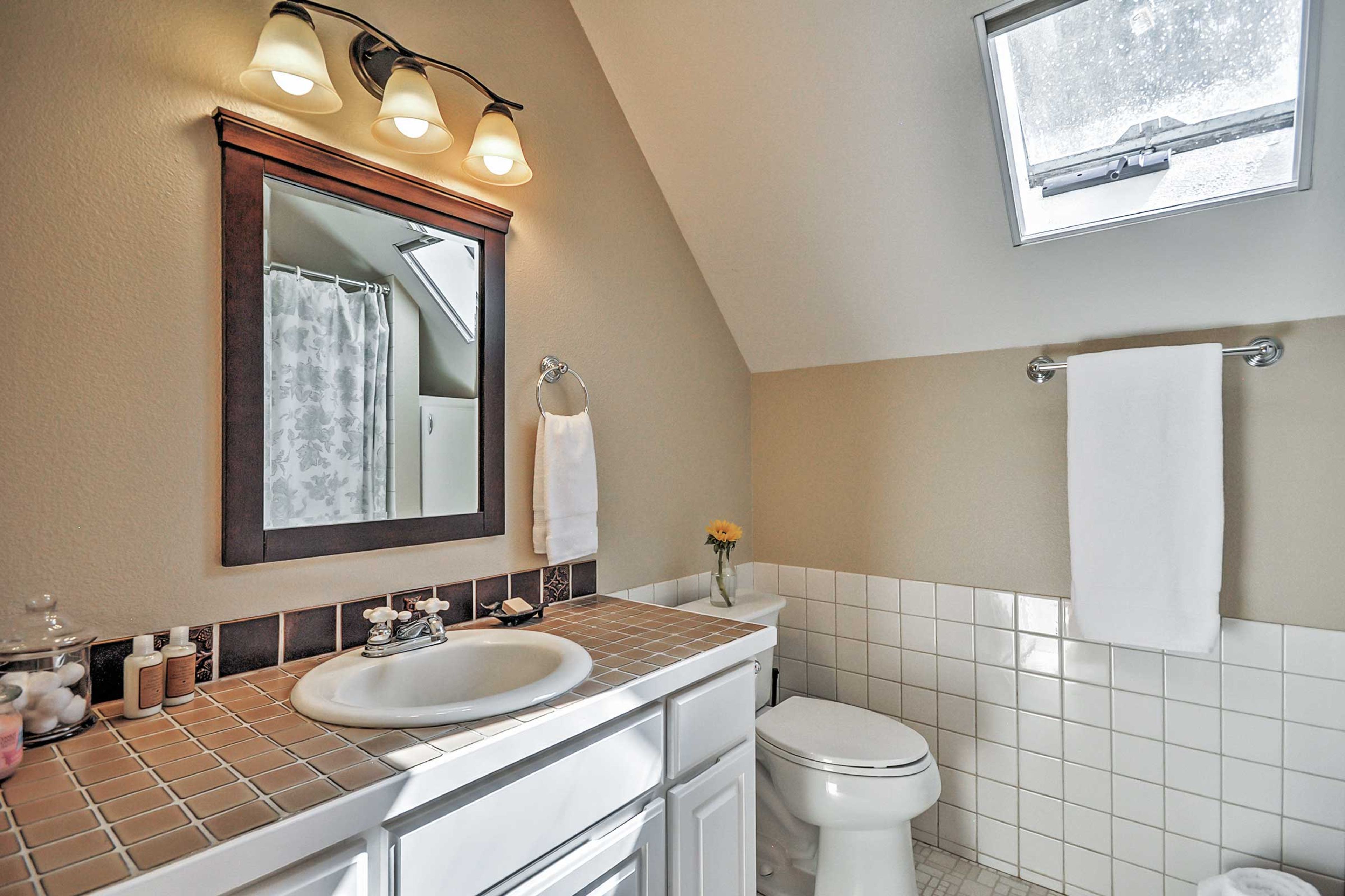 Freshen up before a night on the town in the full bathroom.