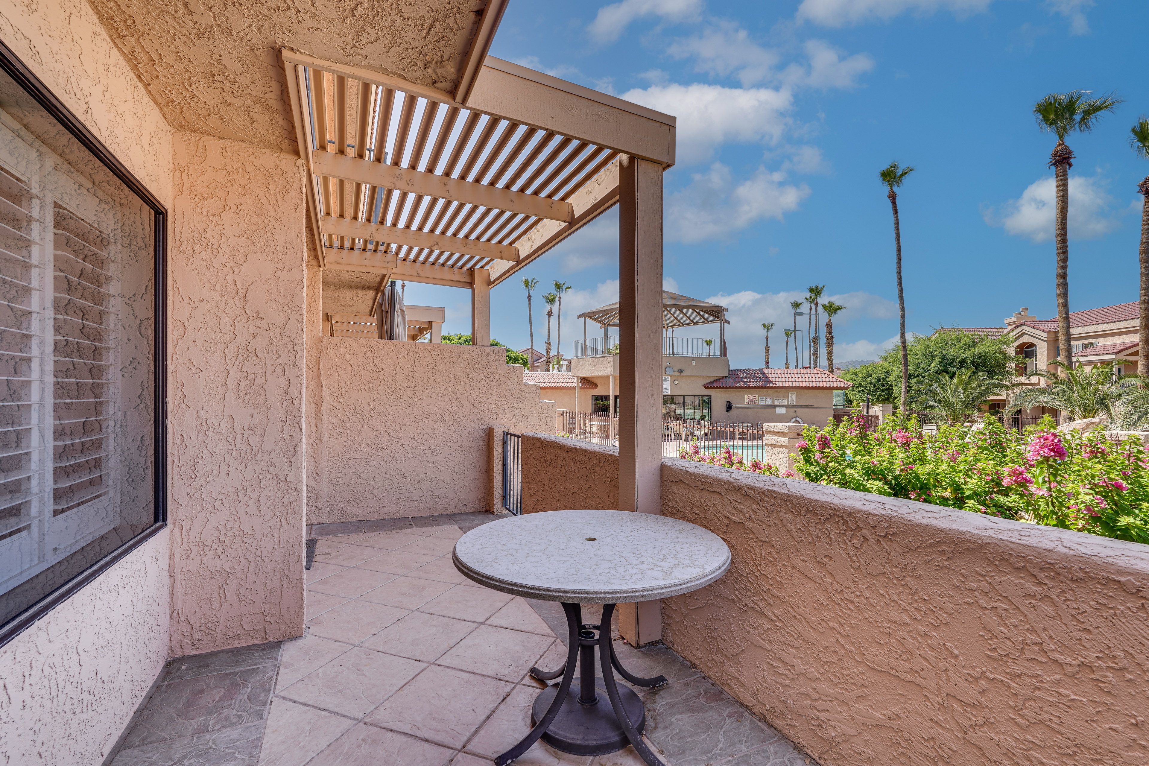 Private Patio | Outdoor Dining | Pool & Mountain Views