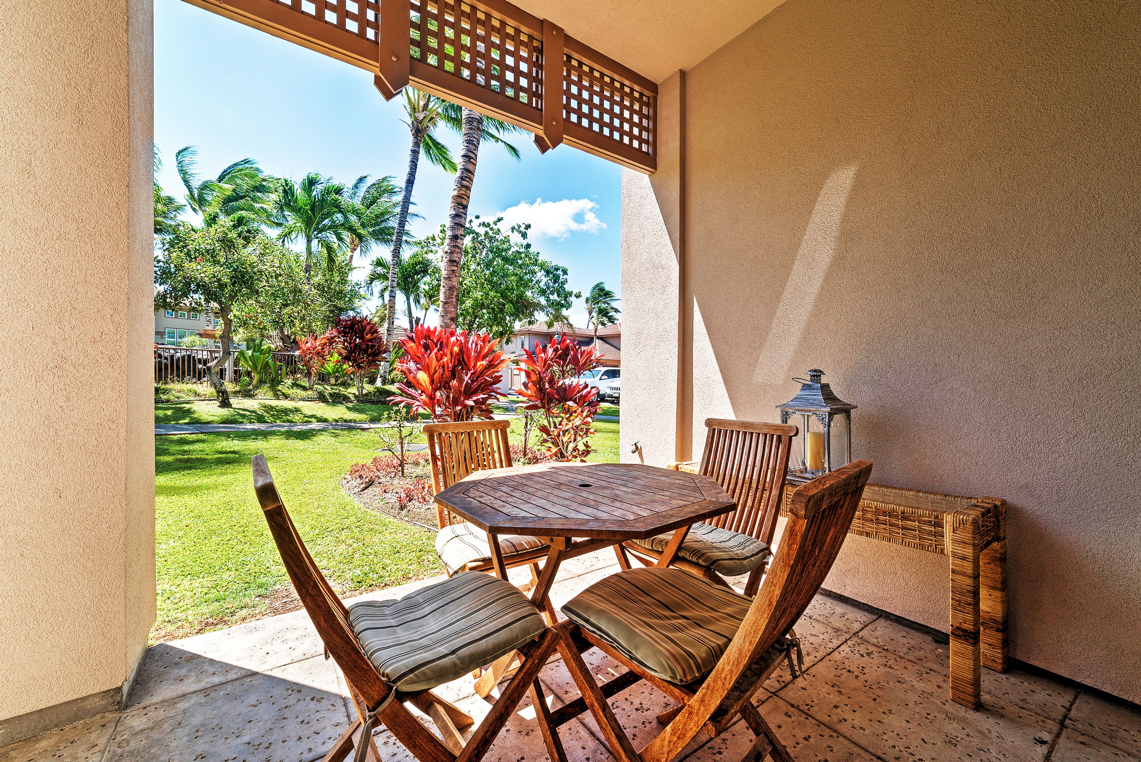 Sip your morning coffee on the private patio overlooking beautiful palm trees.