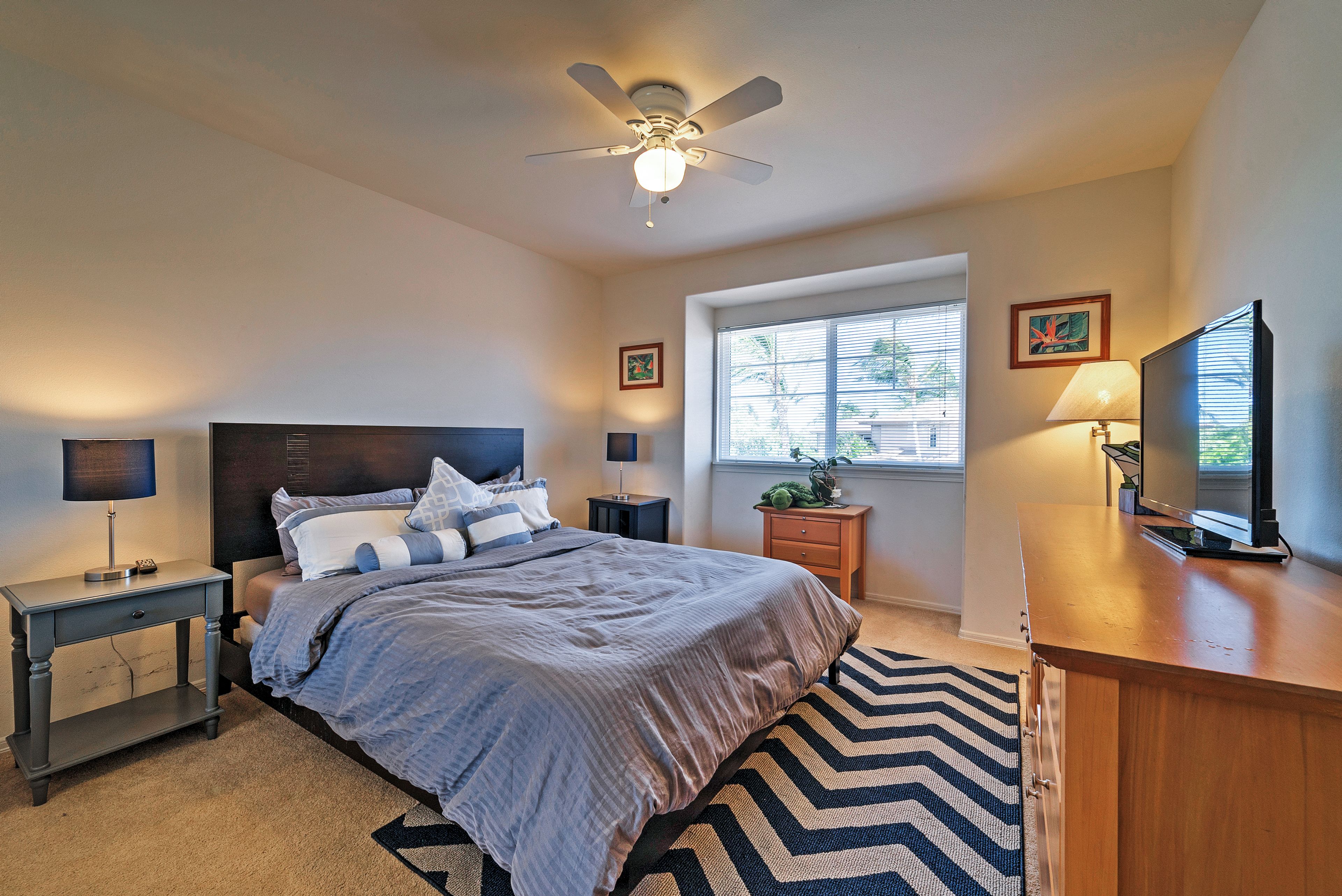 Catch up on your favorite TV shows before drifting off in this Queen Bed.