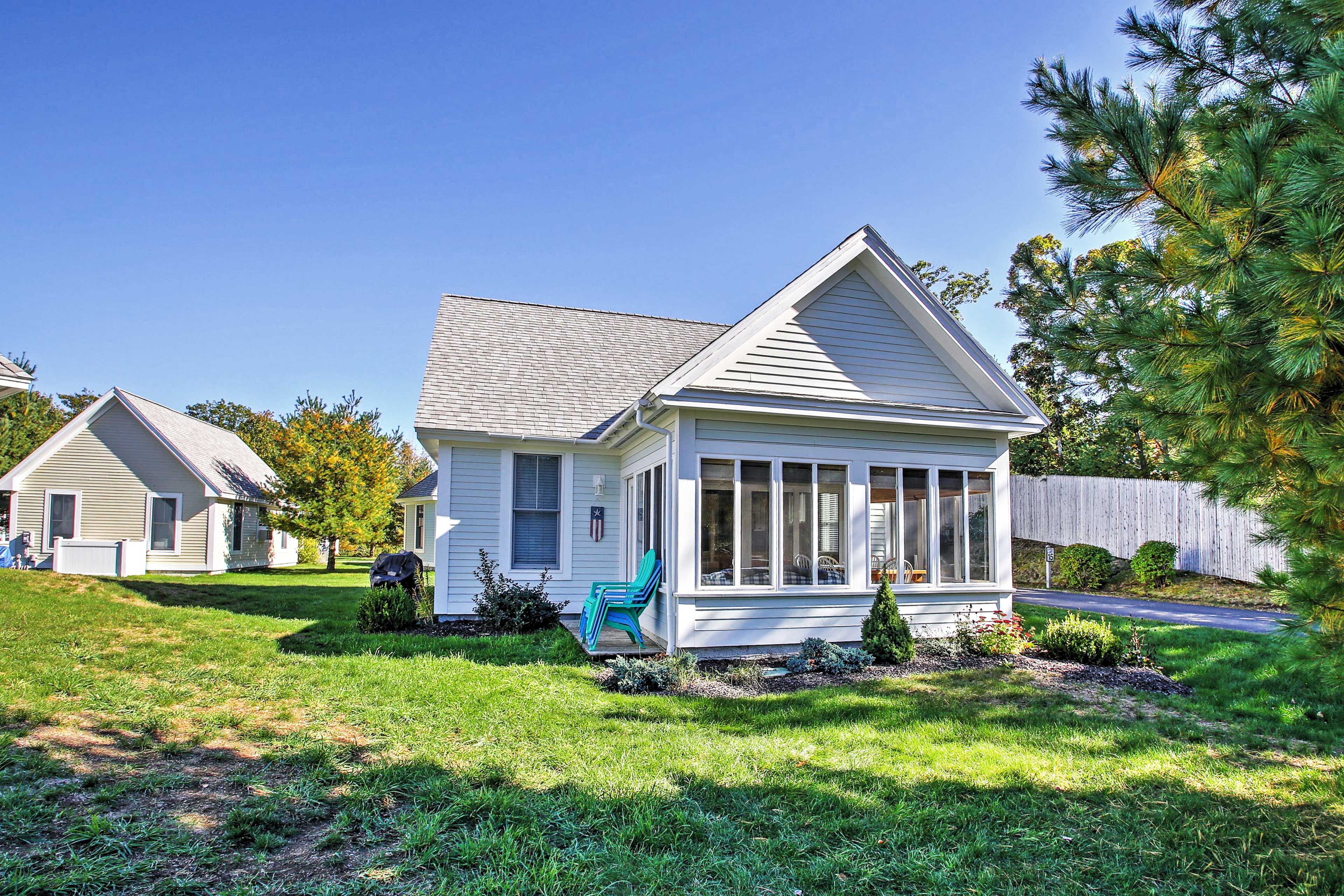 The sun room features lovely floor-to-ceiling paneled windows.