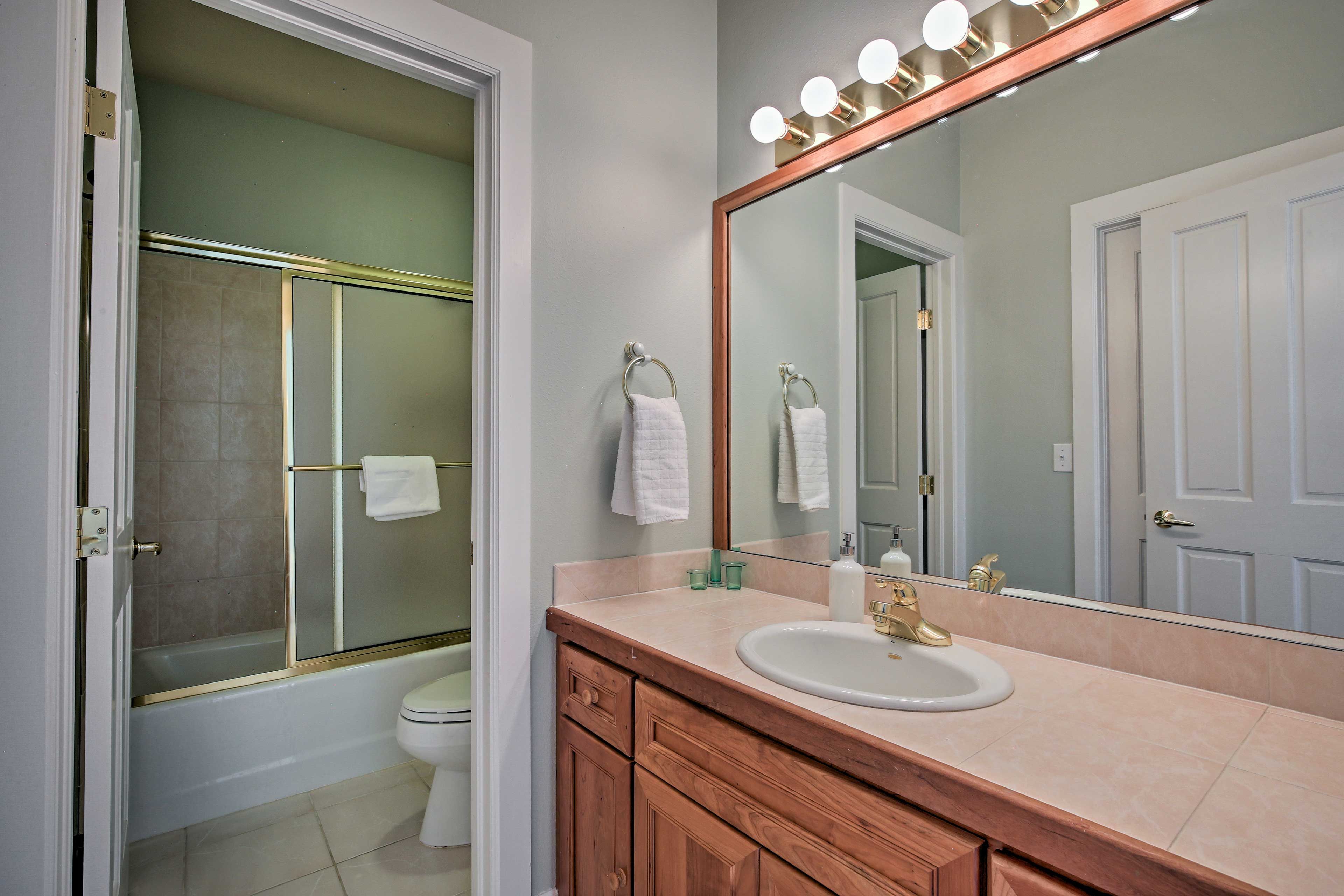 The en-suite bathroom features a shower/tub combo.