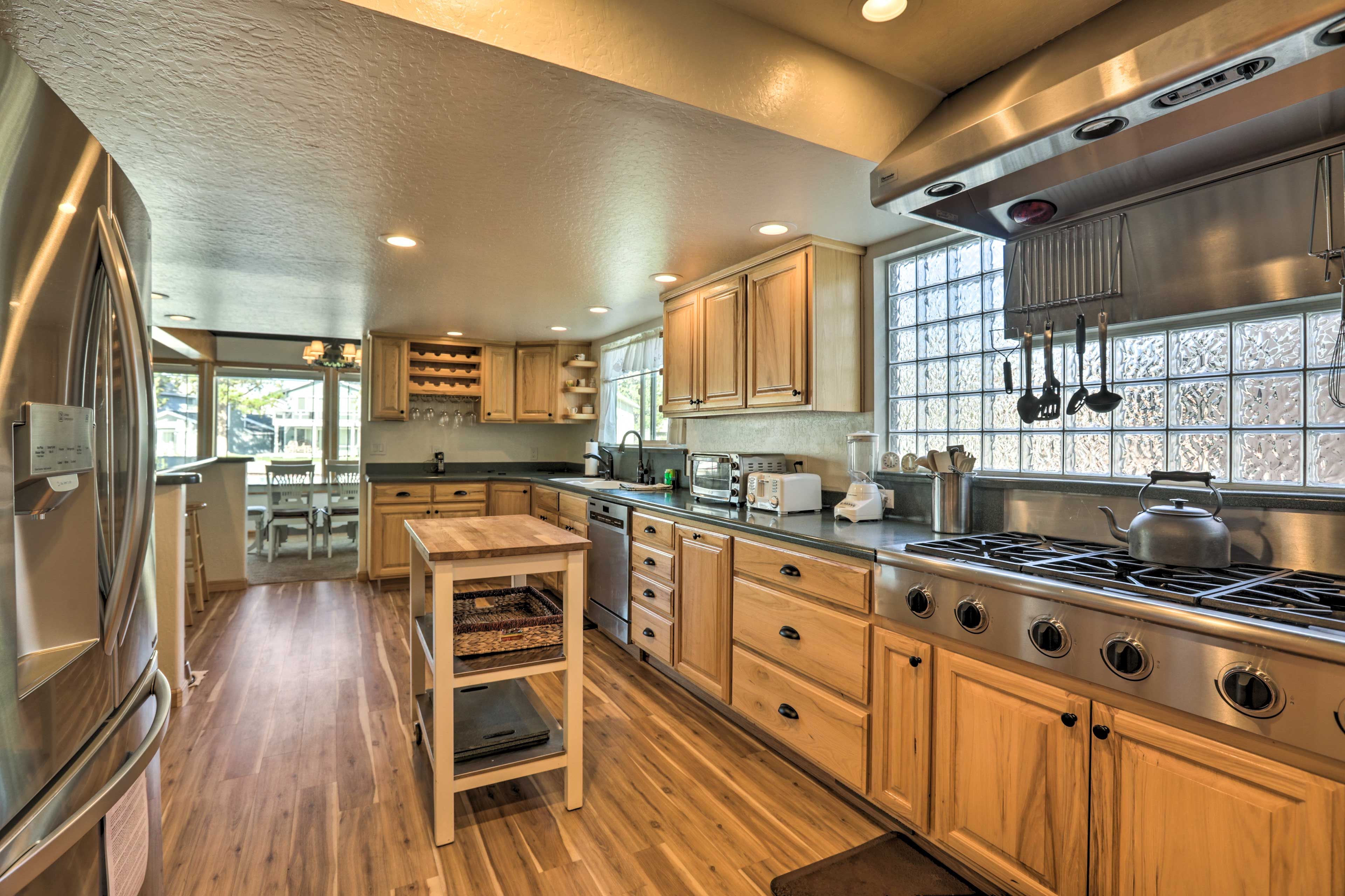 The fully equipped kitchen features top-of-the-line stainless steel appliances.