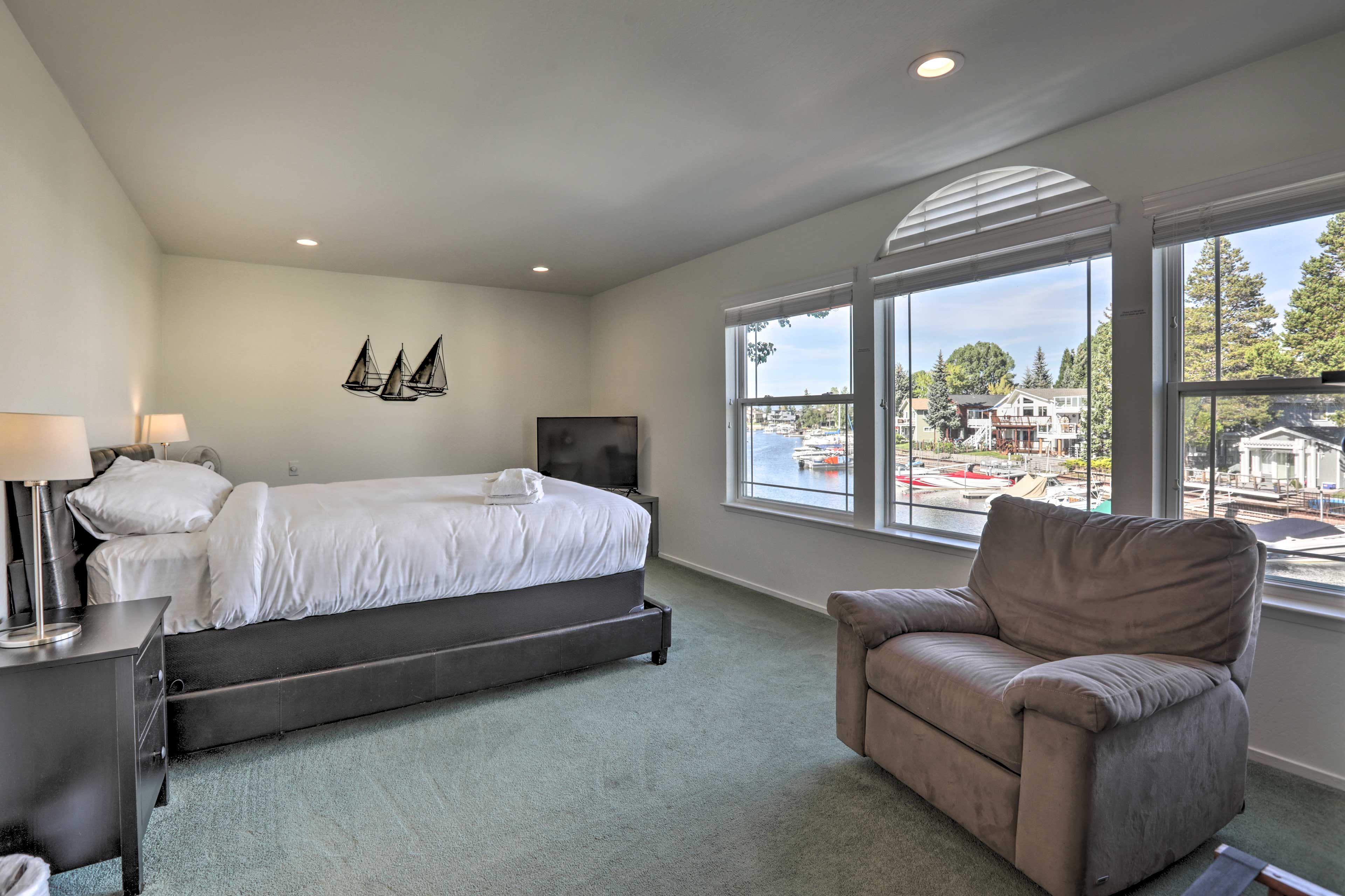 Retreat to the cozy master bedroom with flat screen TV.