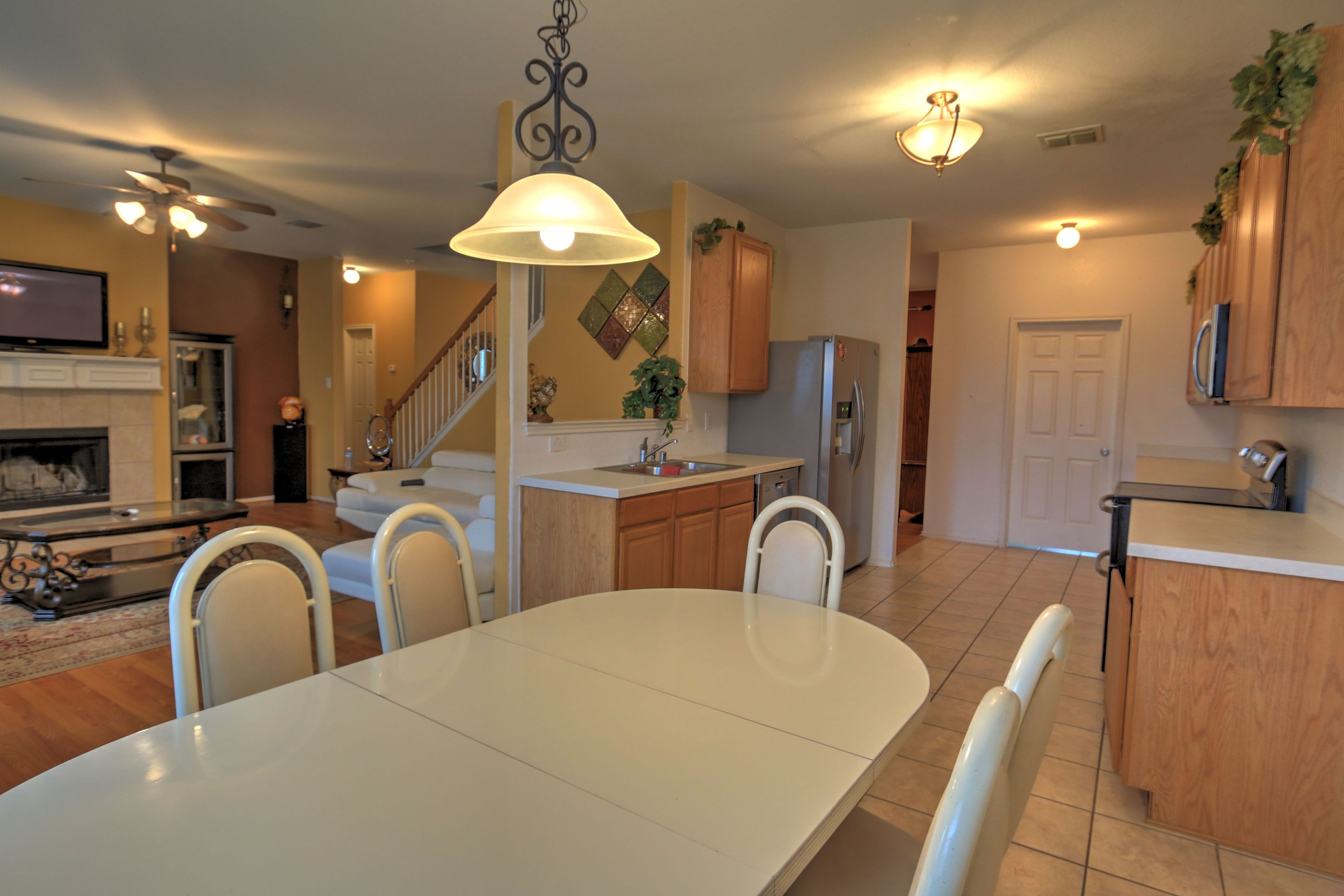 Enjoy a delicious meal at the dining table near the kitchen.