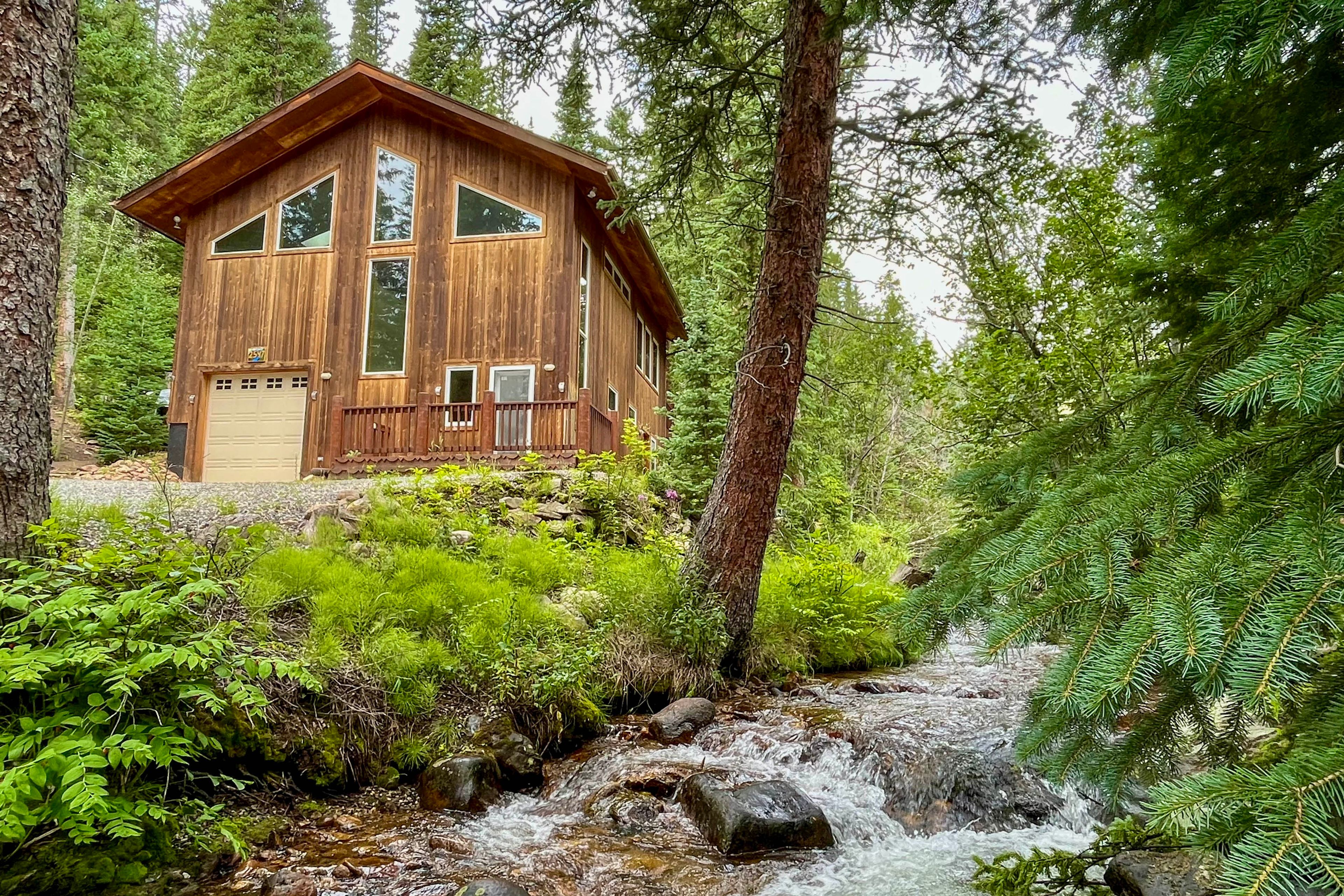 Exterior | Creek On-Site | Wooded Surroundings