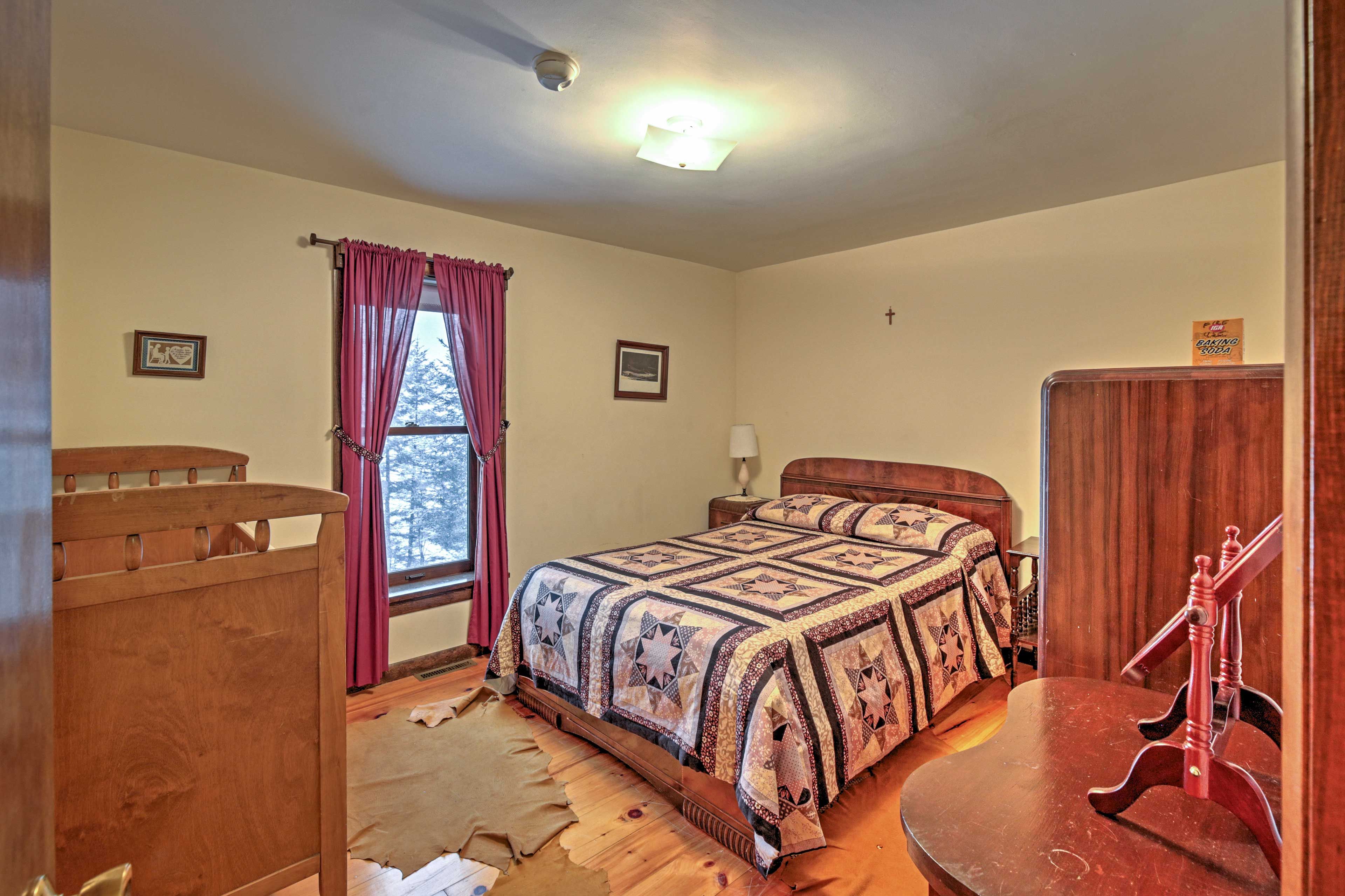 Two guests will sleep soundly in this full bed.