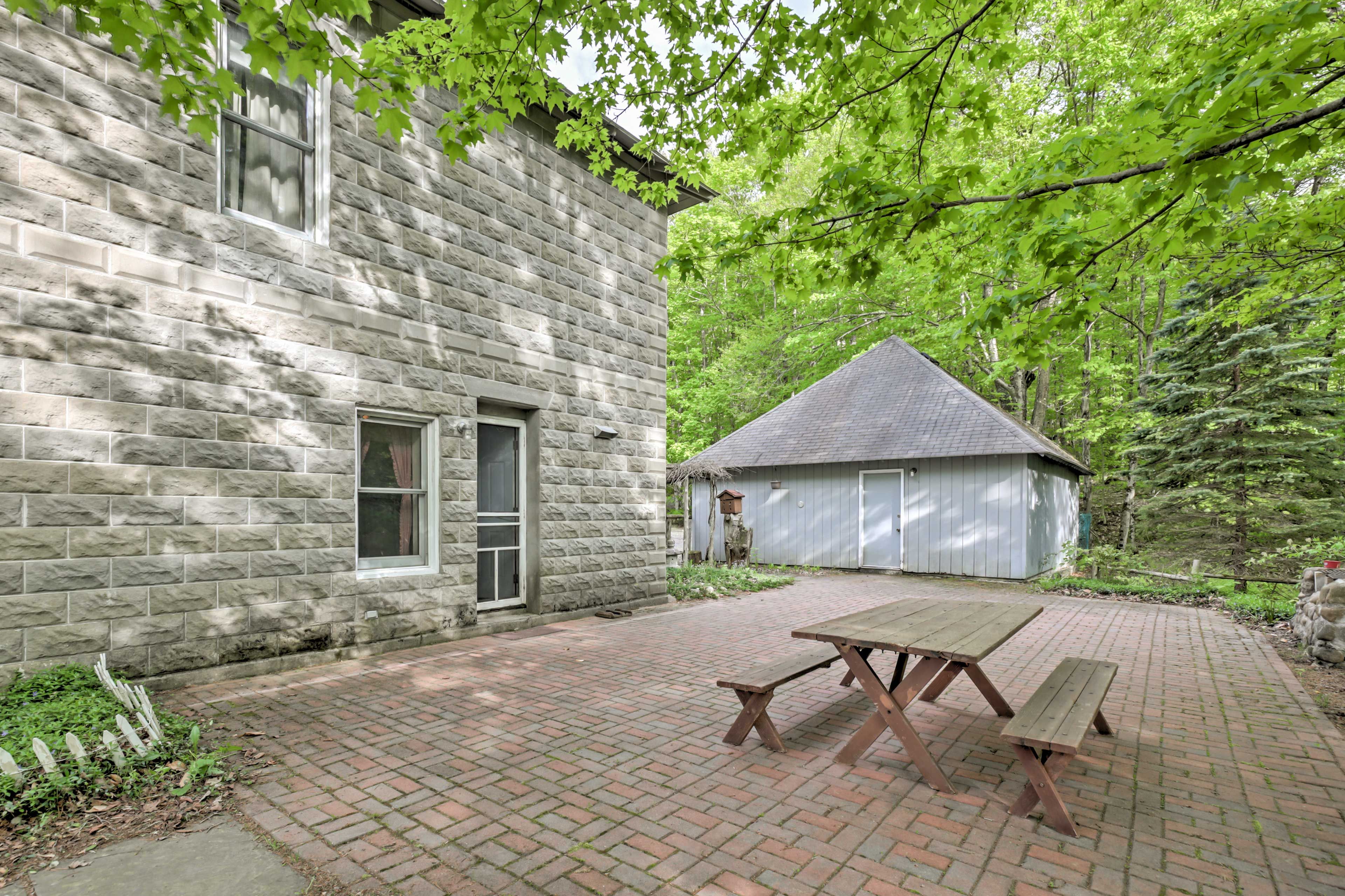 An expansive brick patio adorns the backyard.