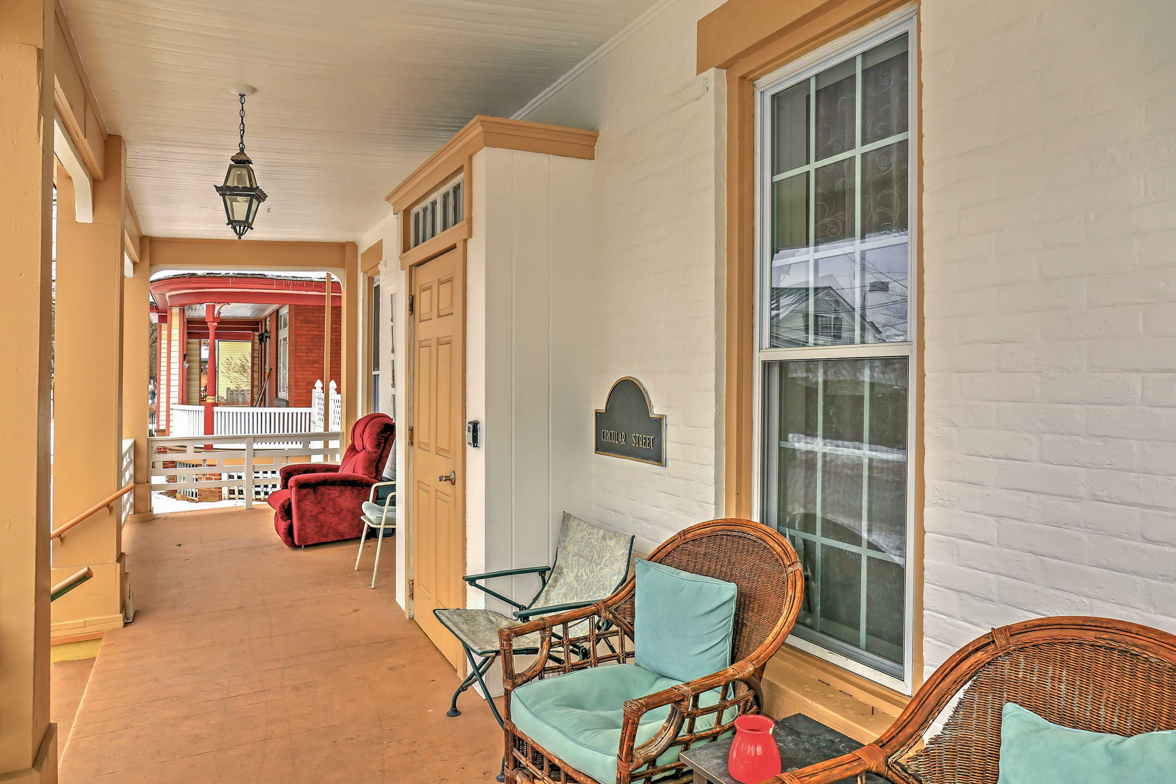 The front porch is the ideal place to sip a glass of wine.