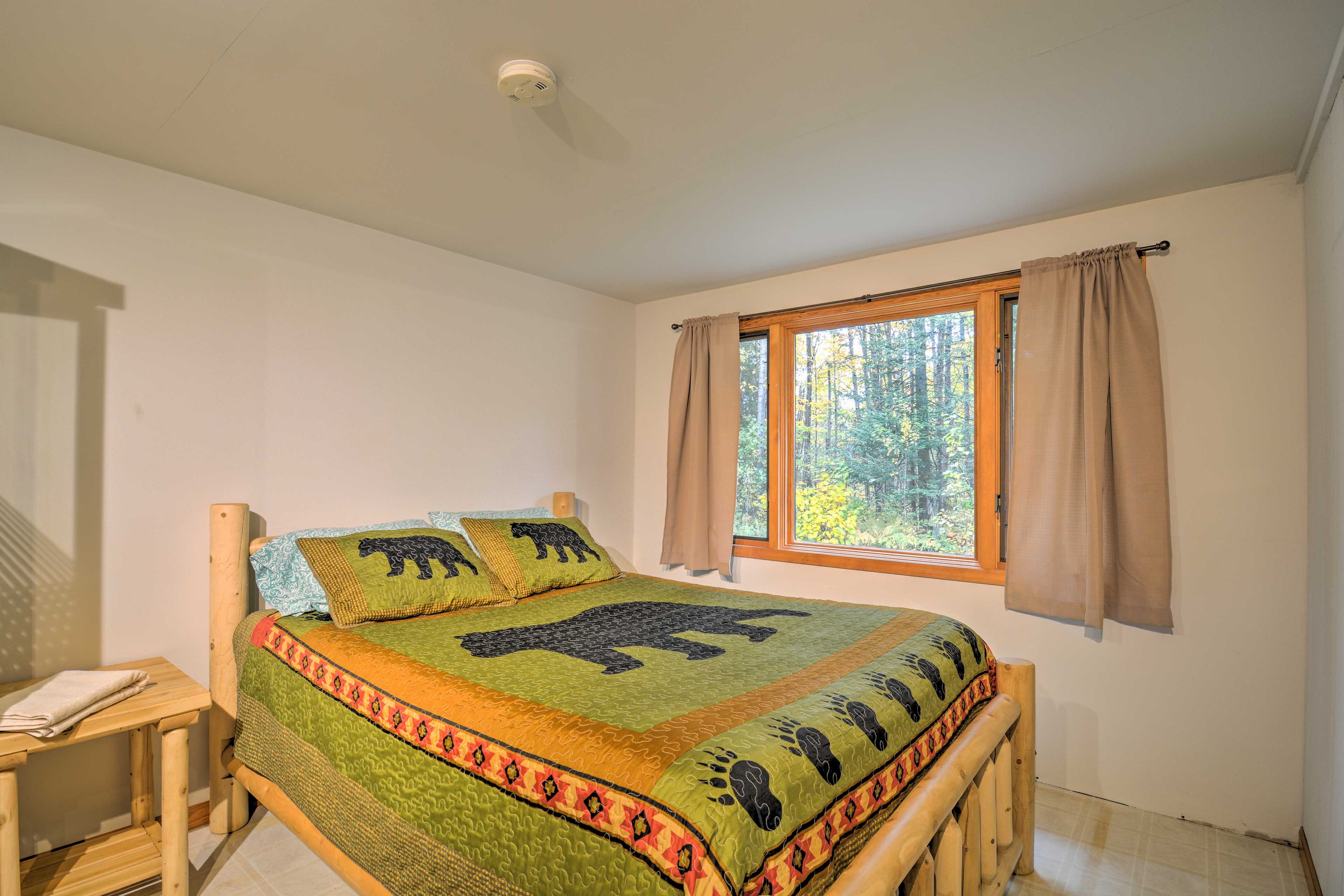 Claim this queen bed as your own.