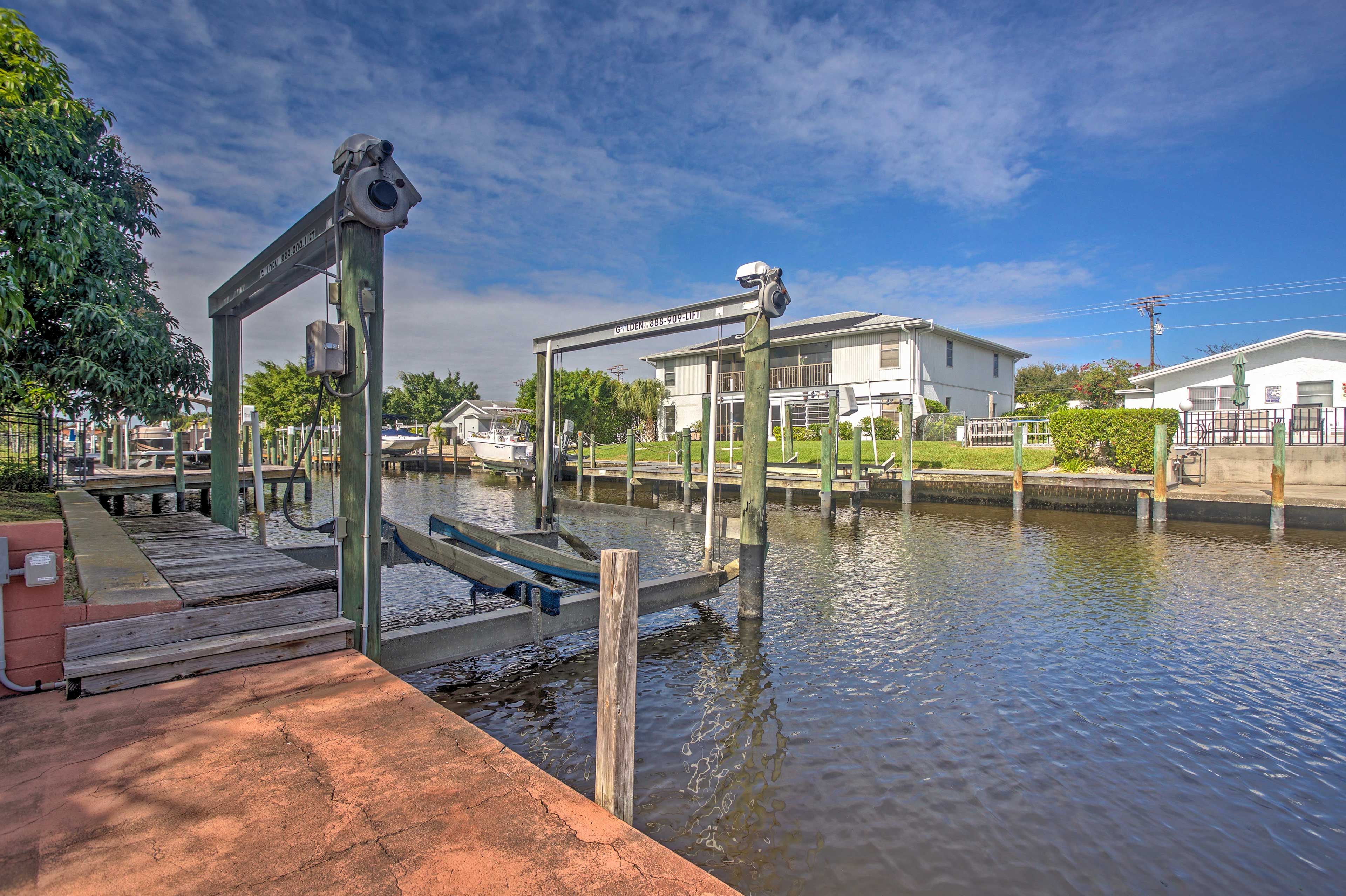 The home sits waterfront on the serene canals of Cape Coral.