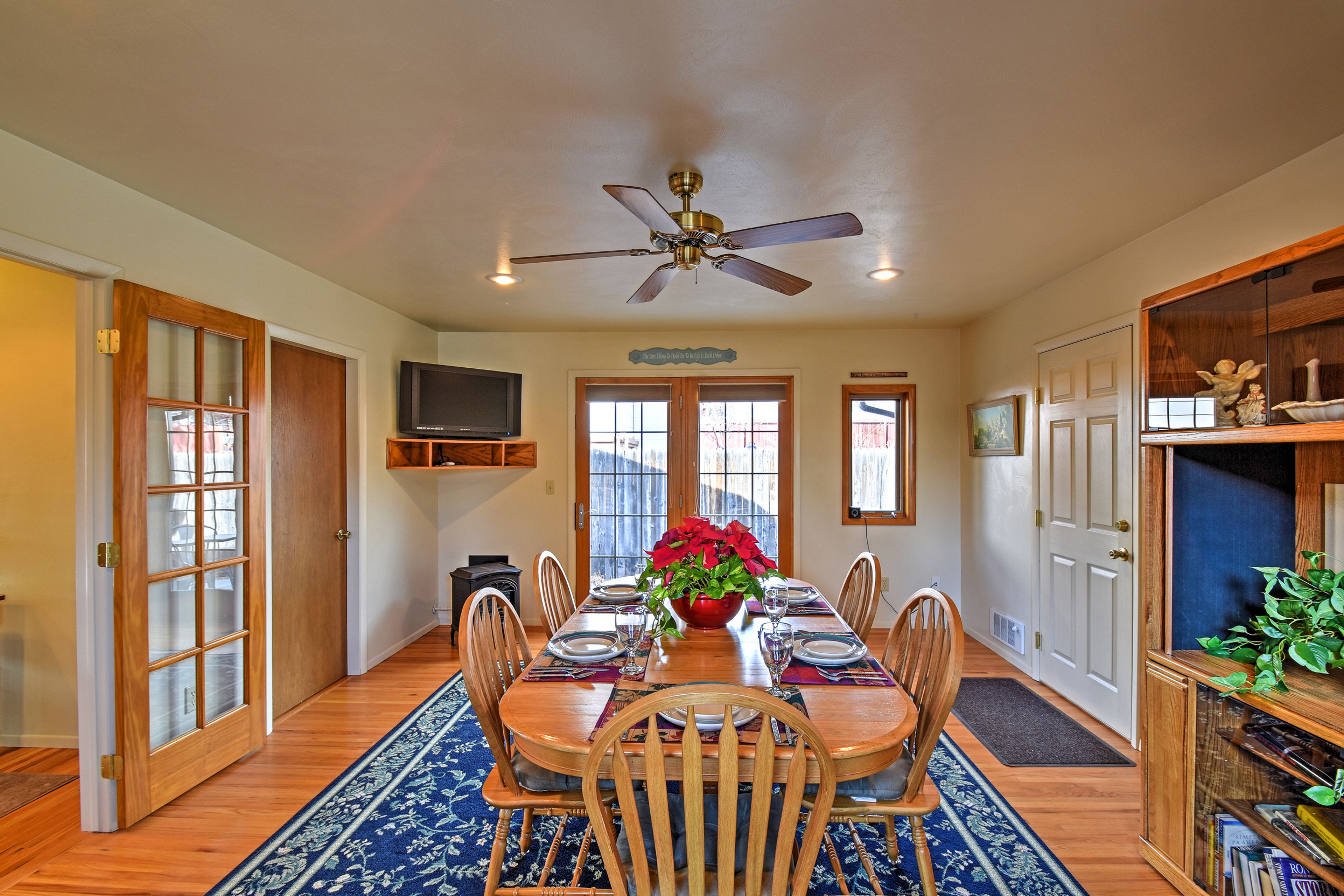 Gather around the lovely dining table with seating for 10 to enjoy your meals.