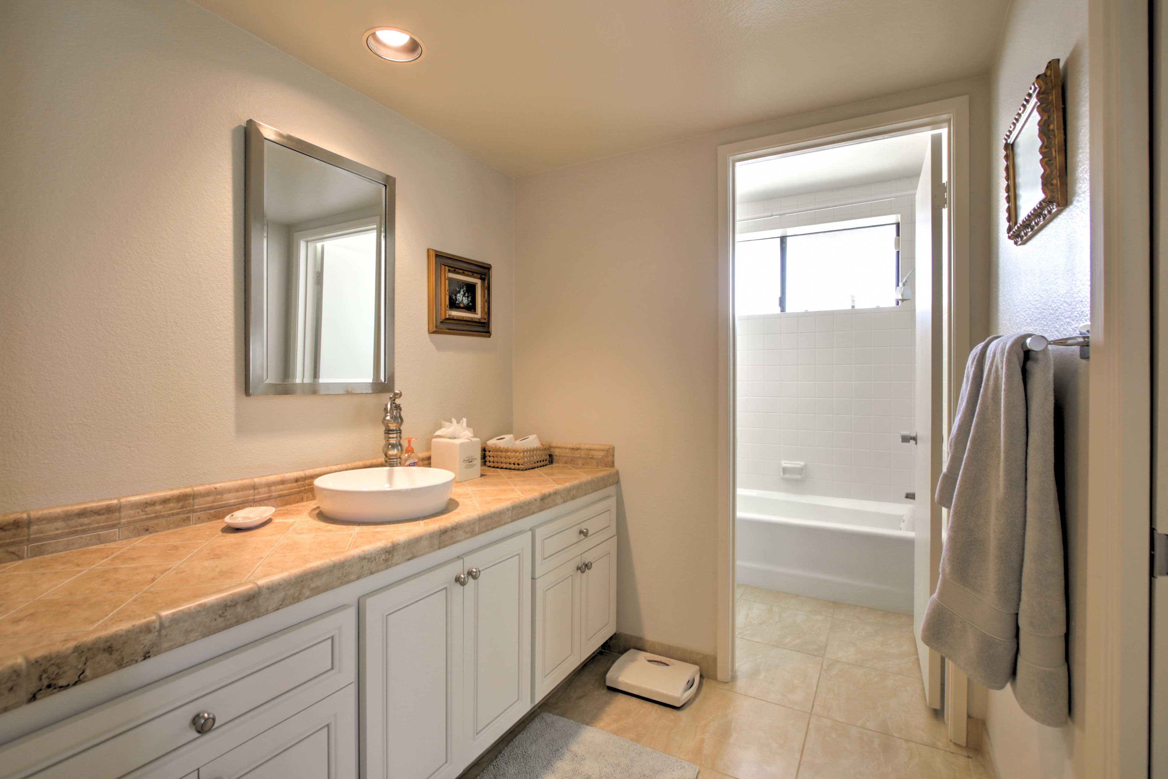 Wash up in the pristine third en-suite bath complete with a shower/tub combo.