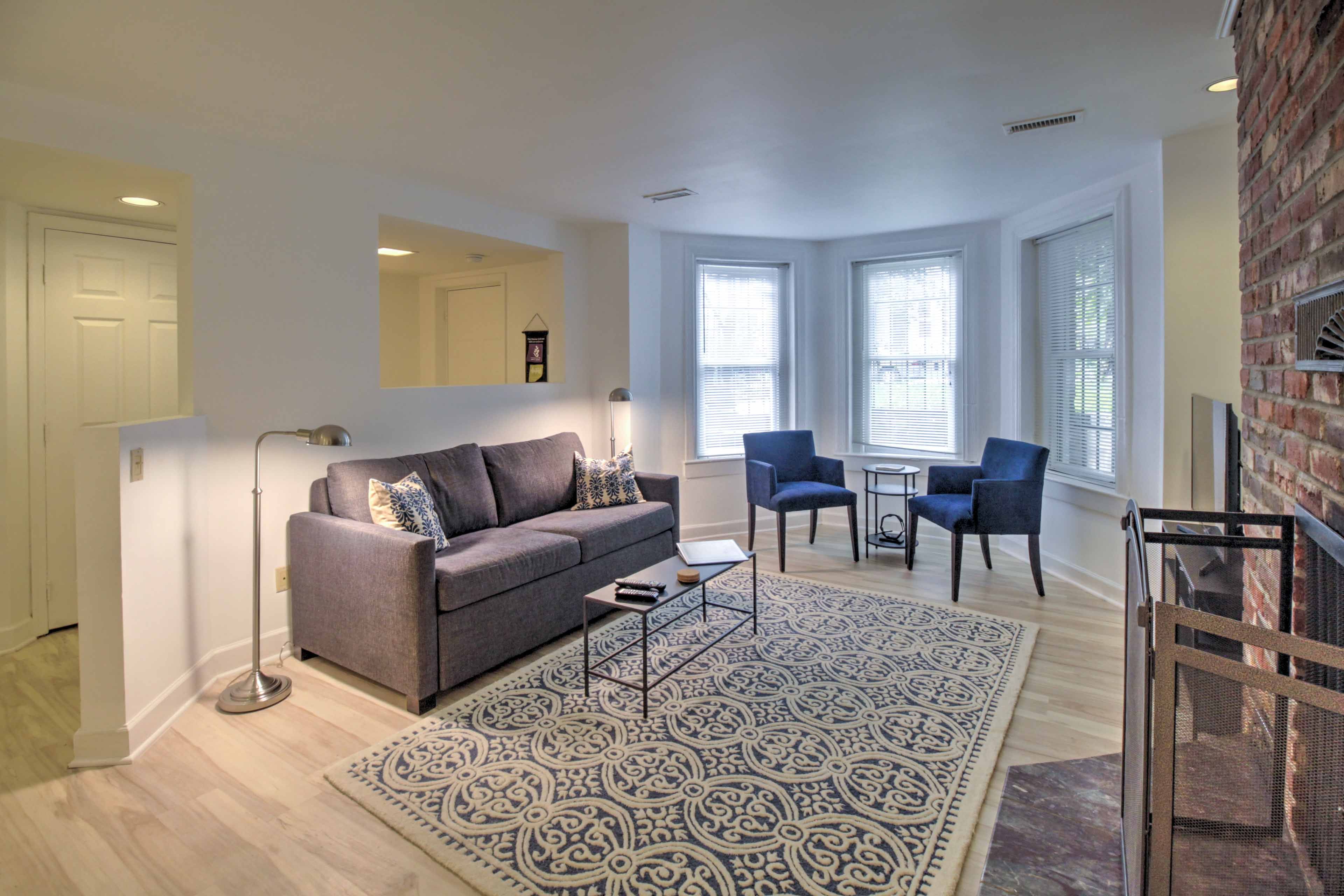 Bay windows help illuminate the living room with lots of natural light.