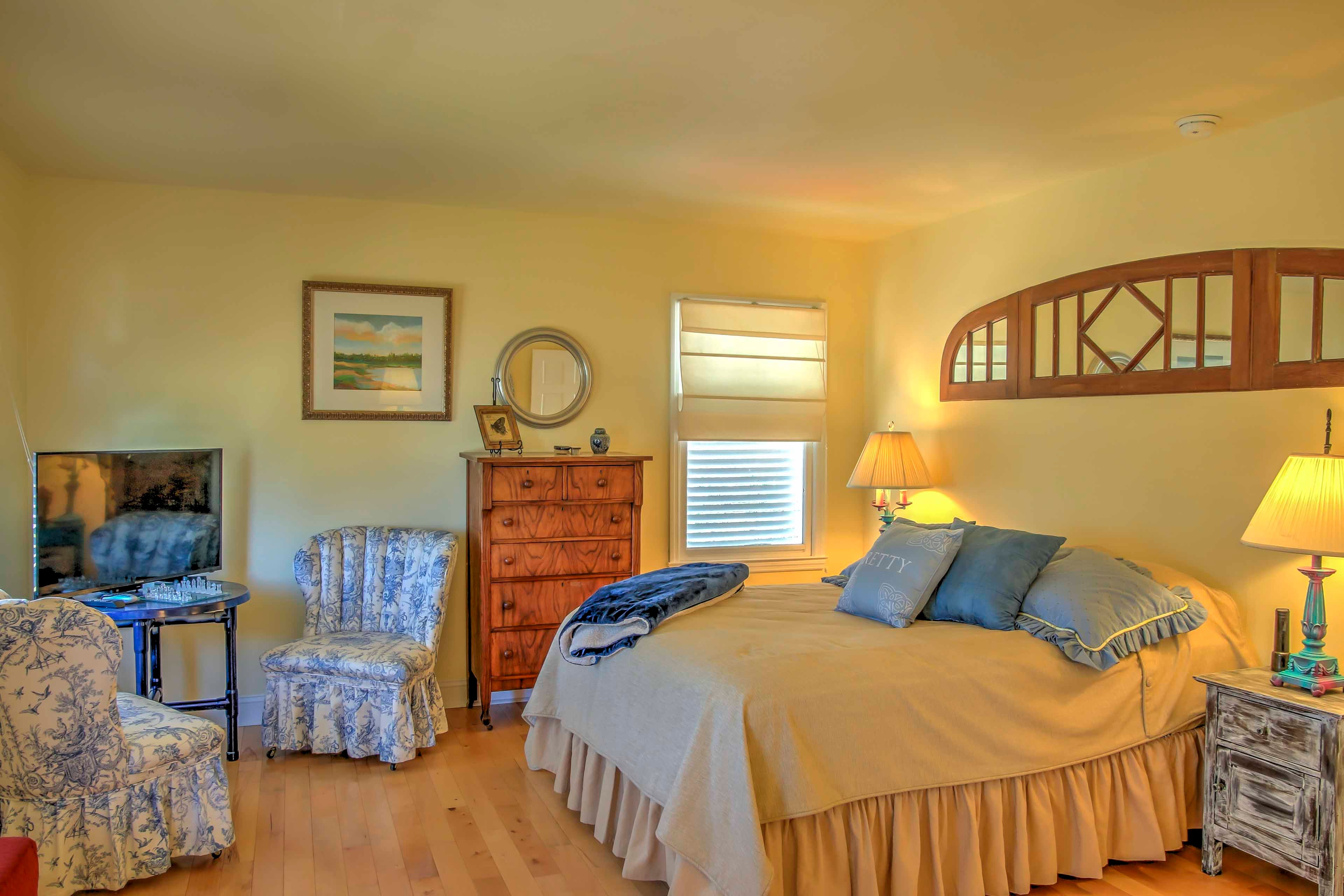 This bedroom features a plush queen-sized bed.