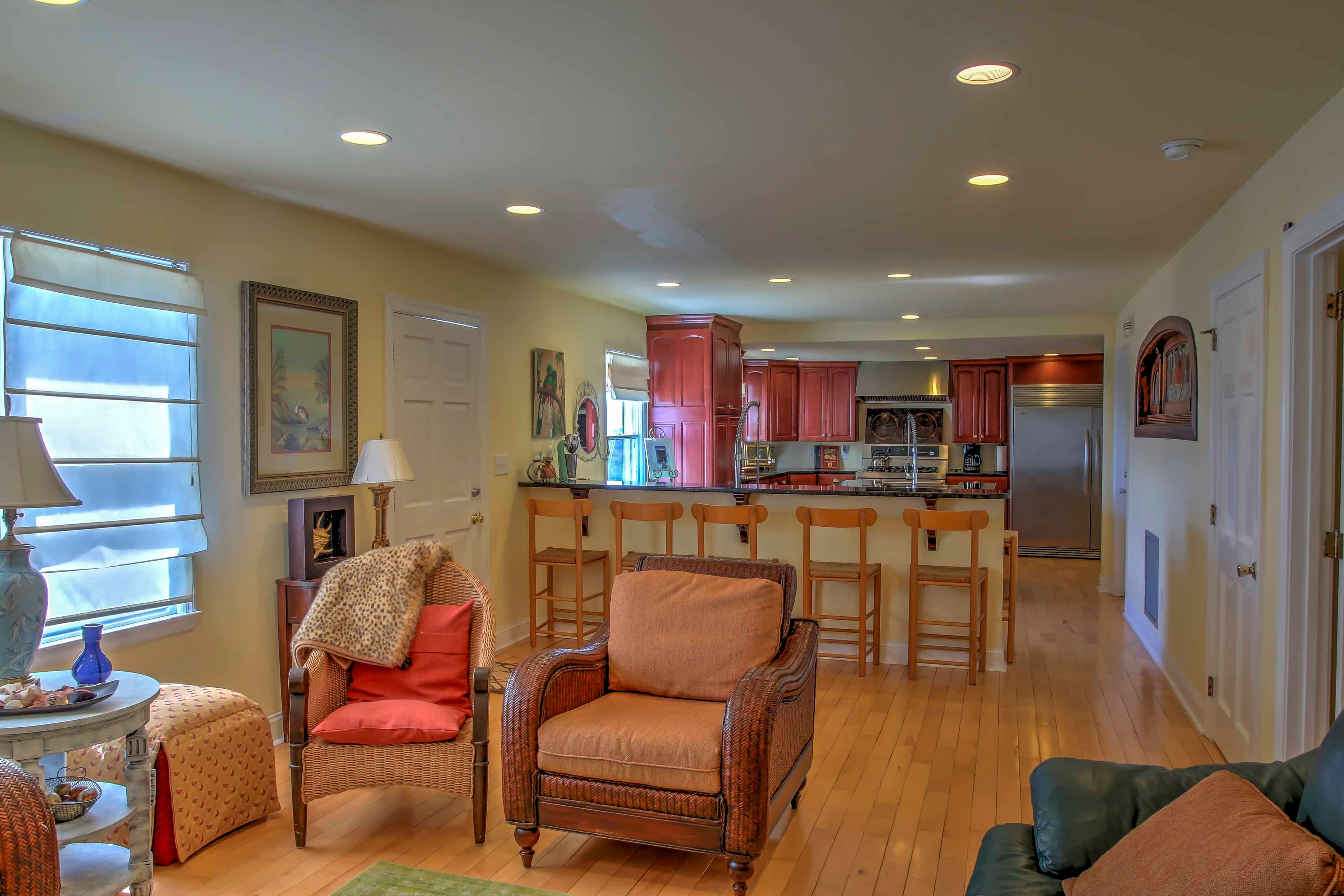 Pull up a tall chair to the bar overlooking the beautifully designed kitchen.