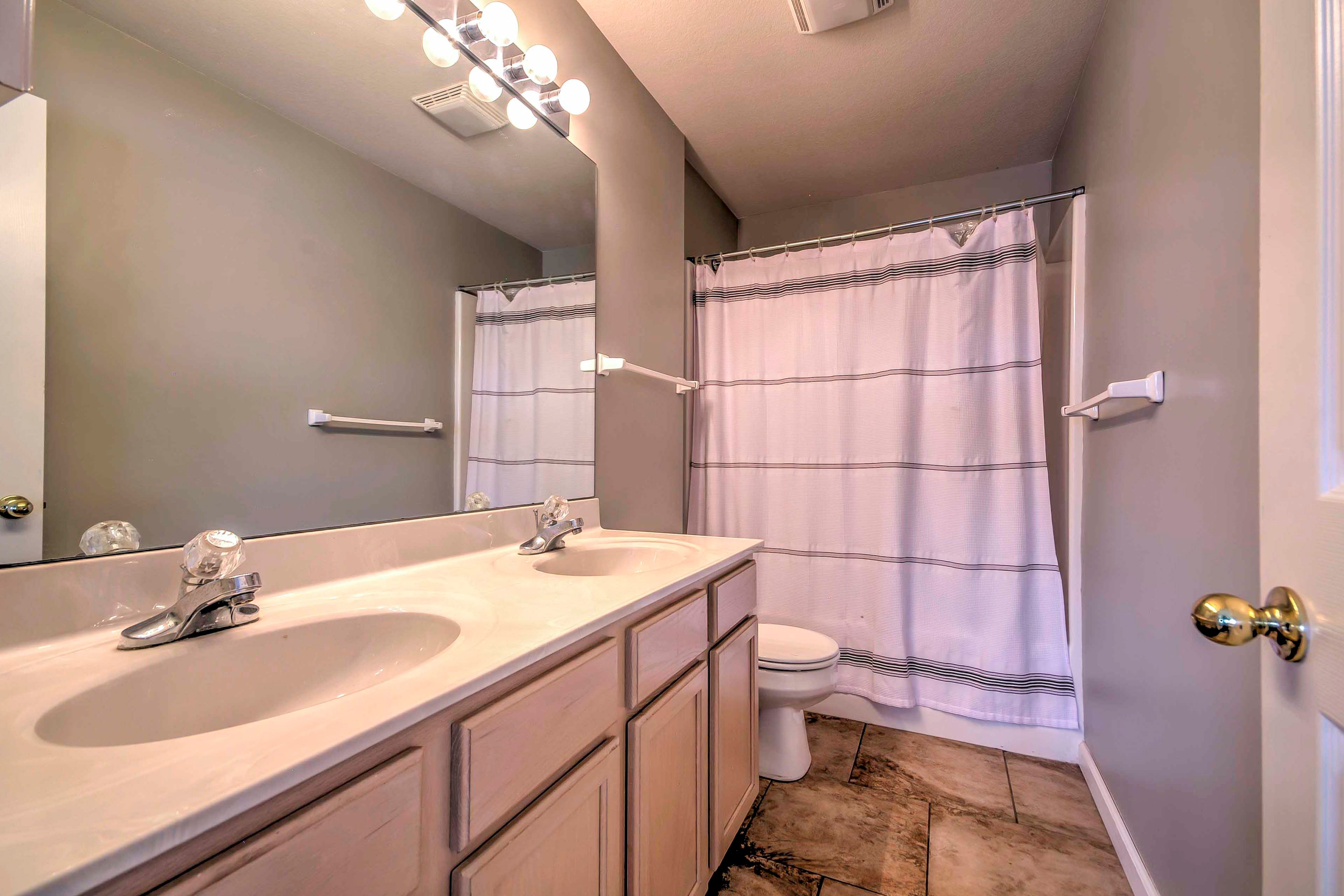 Feel refreshed and energized for the day after a shower in this bathroom.