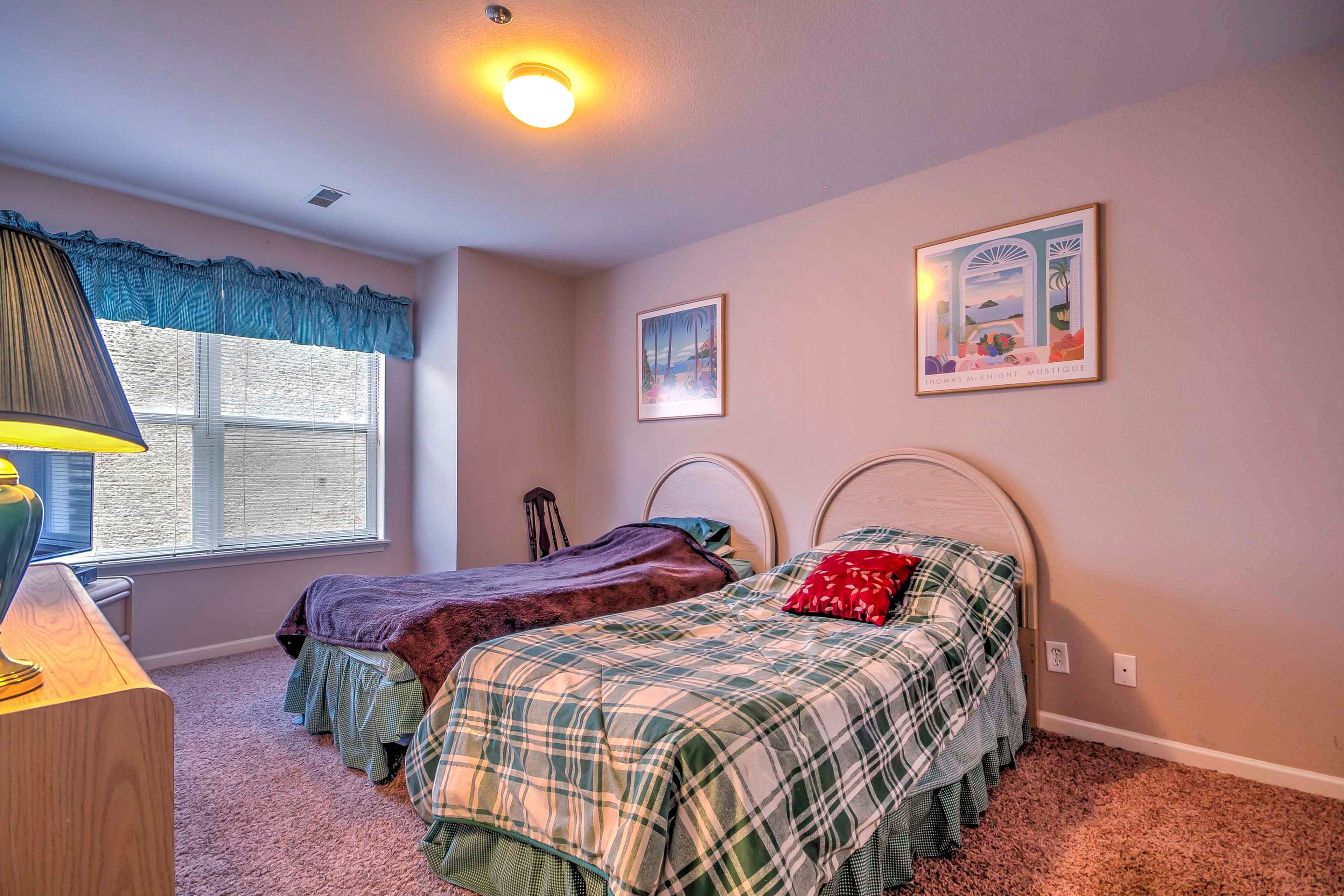 Kids will love sharing this bedroom with 2 twin-sized beds.