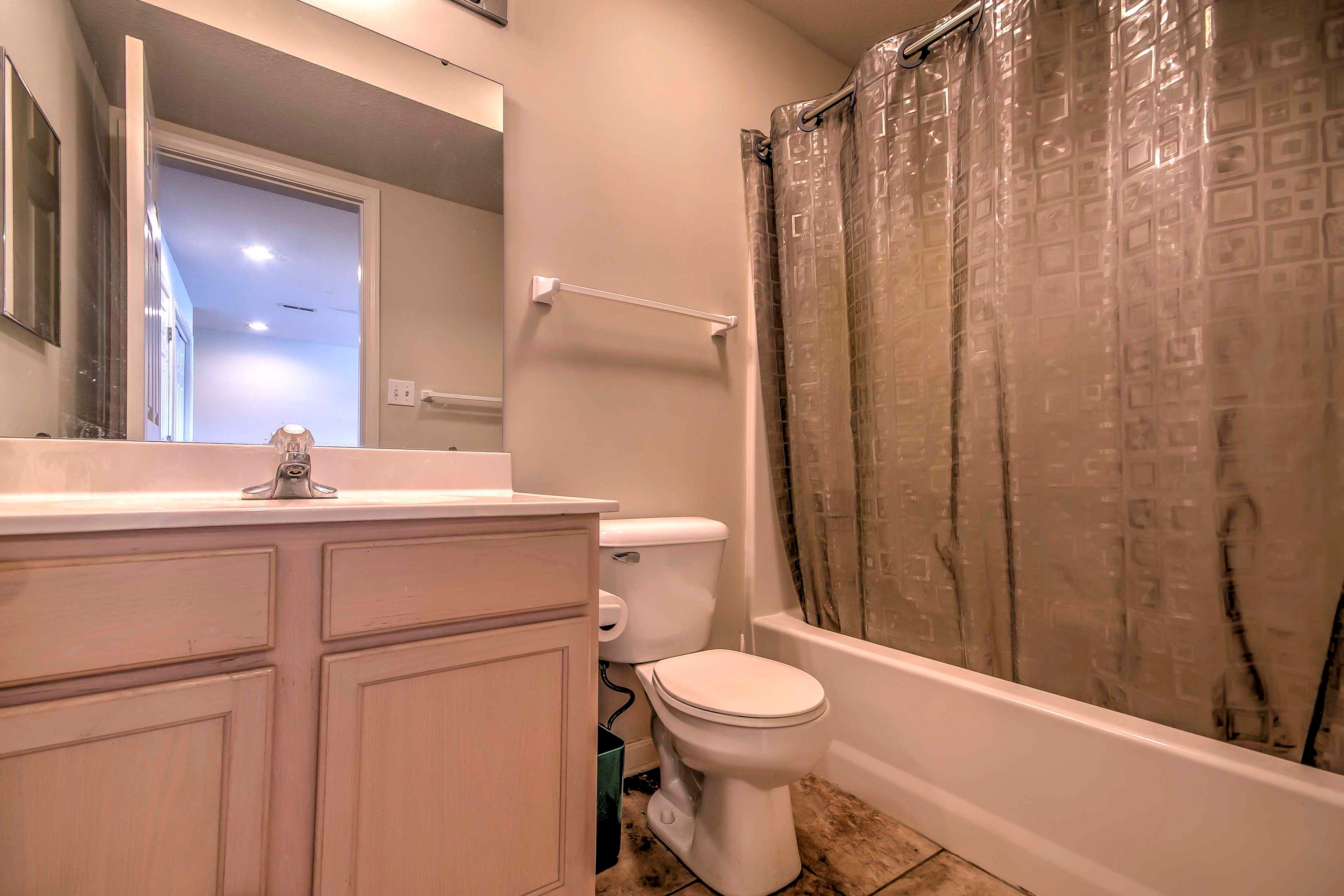 Get ready for the day in this full bathroom with shower/tub.