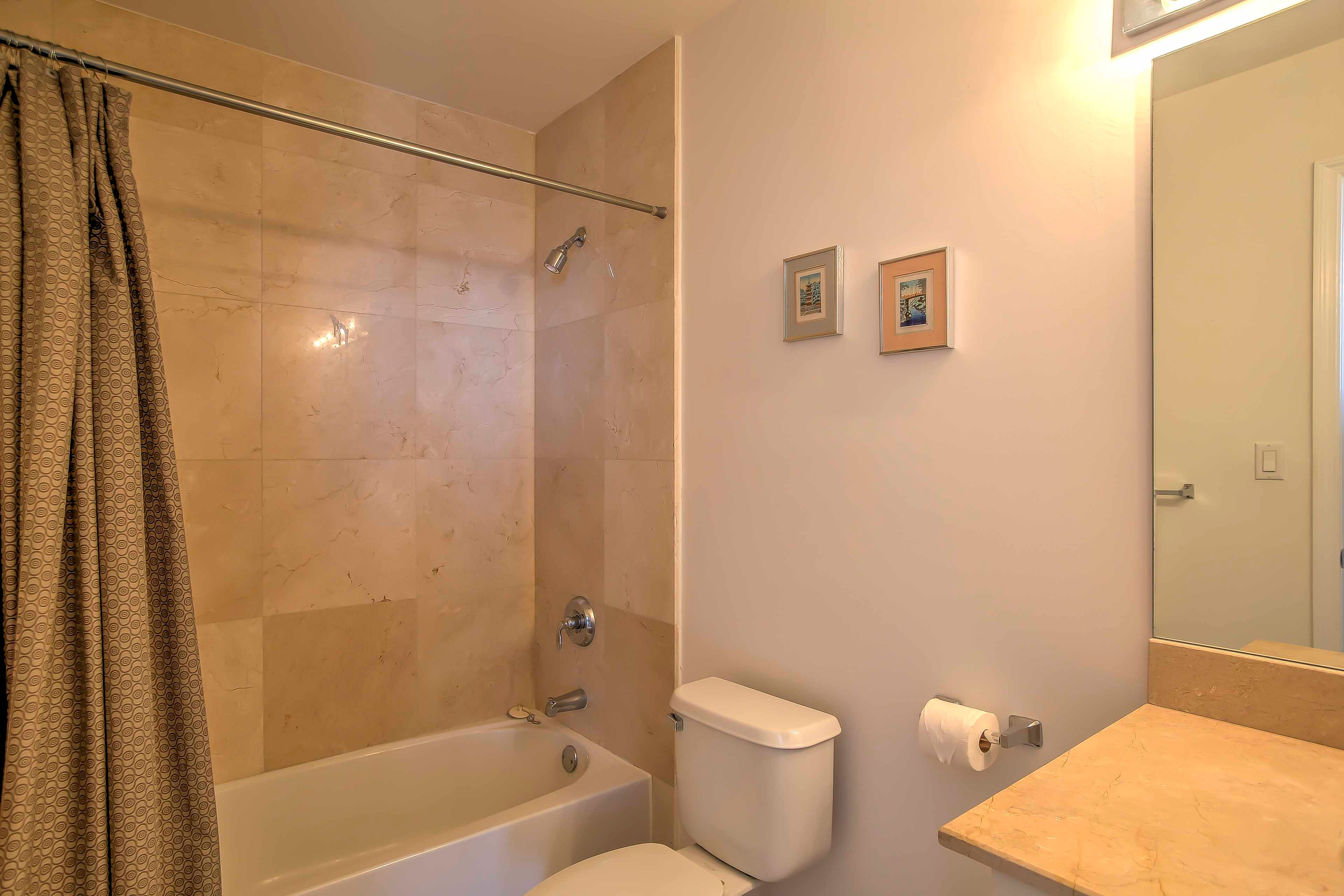 There are 5 full bathrooms and 1 half bath.