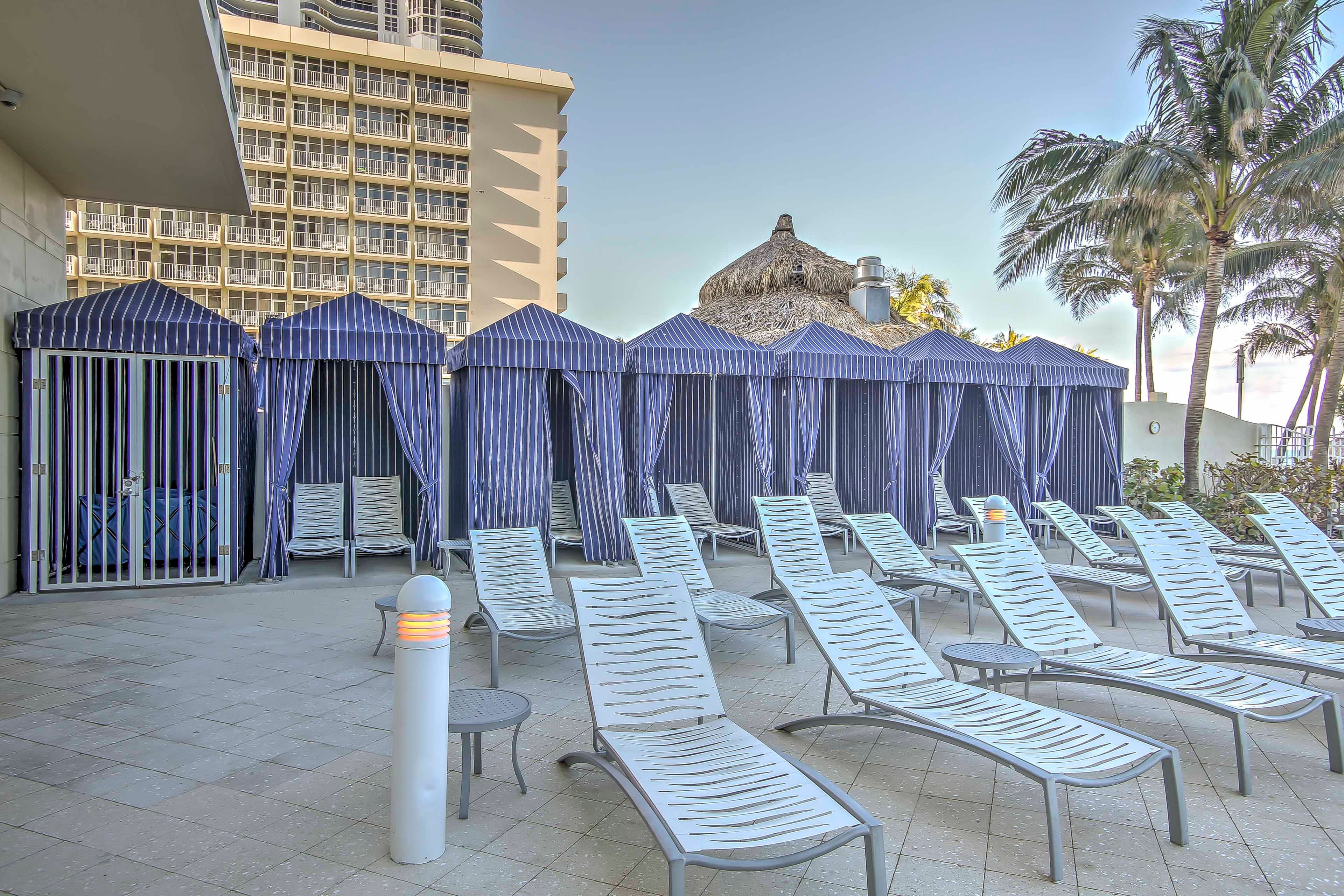 Catch a tan by the cabanas.
