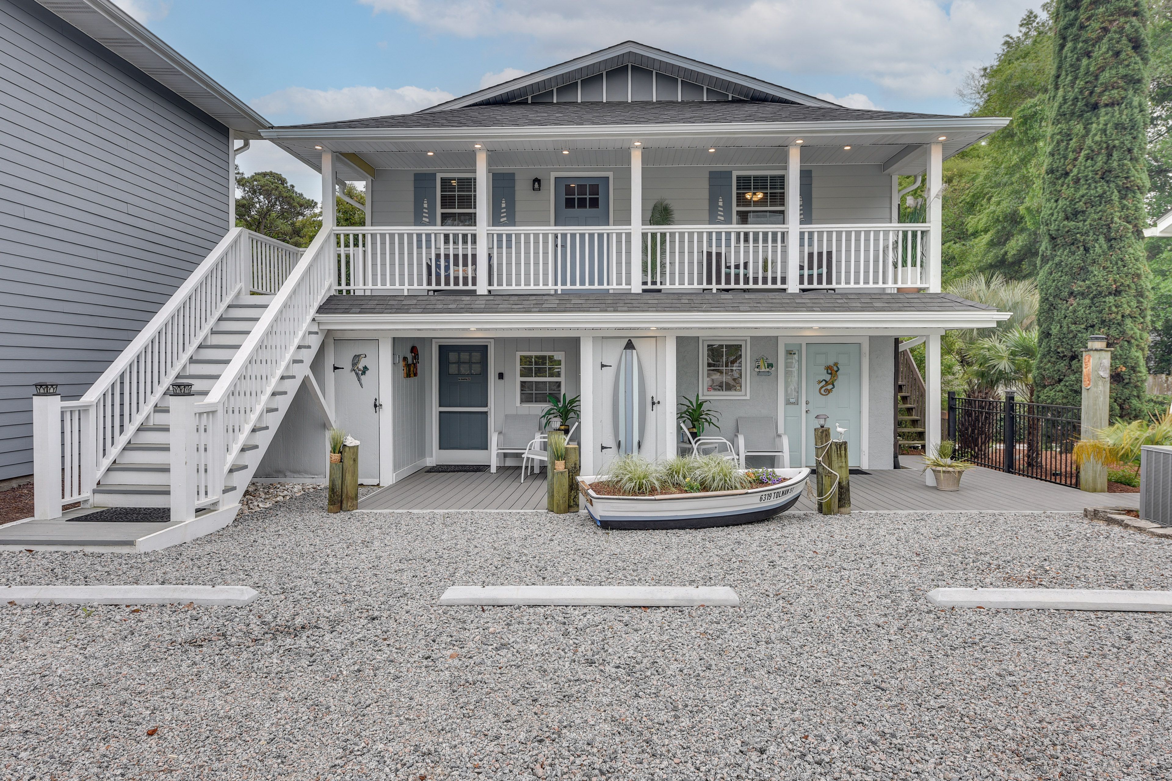 Studio Exterior | Open Parking in Gravel Area | 2 Other Vacation Rentals On-Site