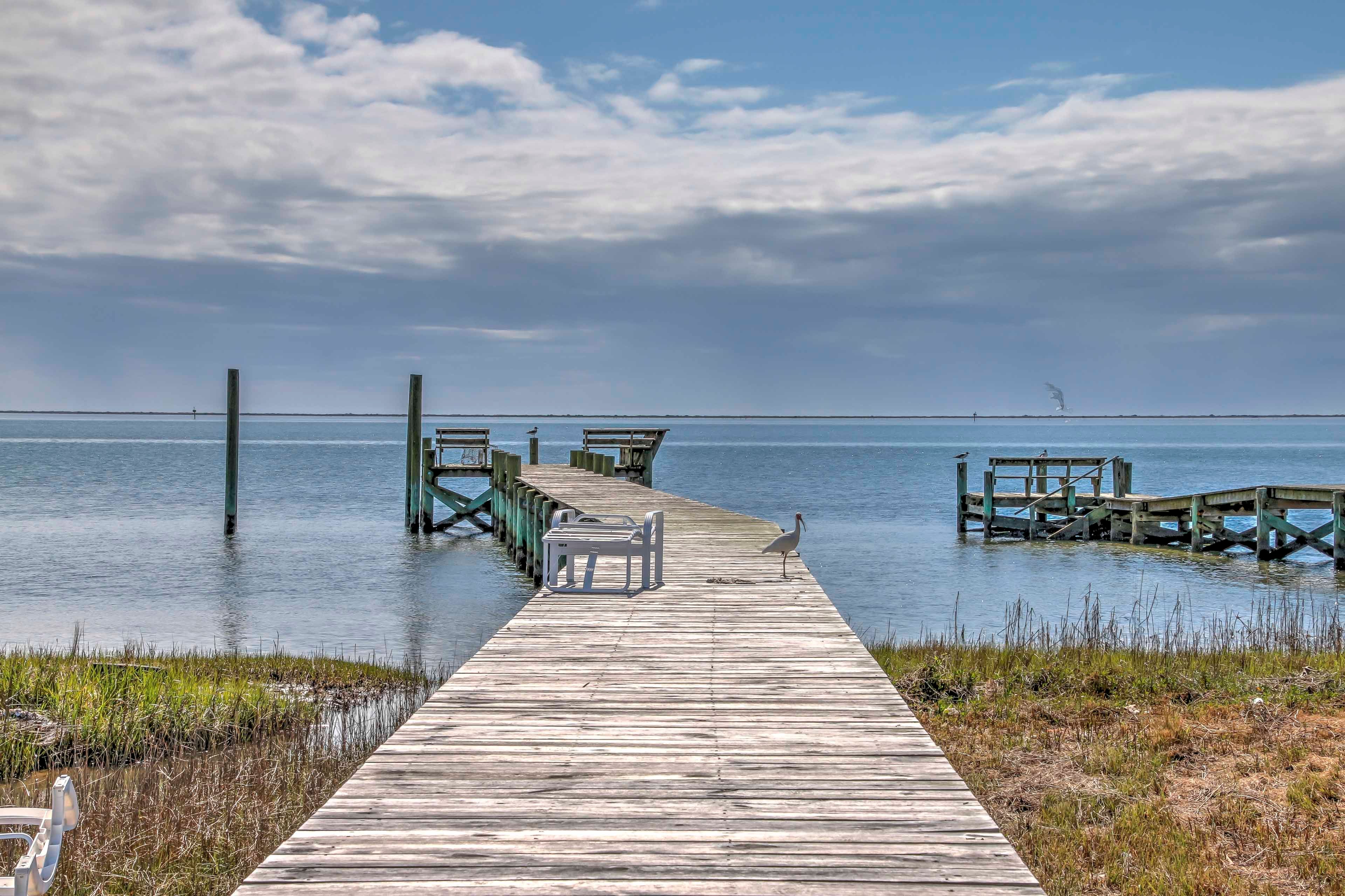This coastal North Carolina vacation rental apartment boasts its own dock!