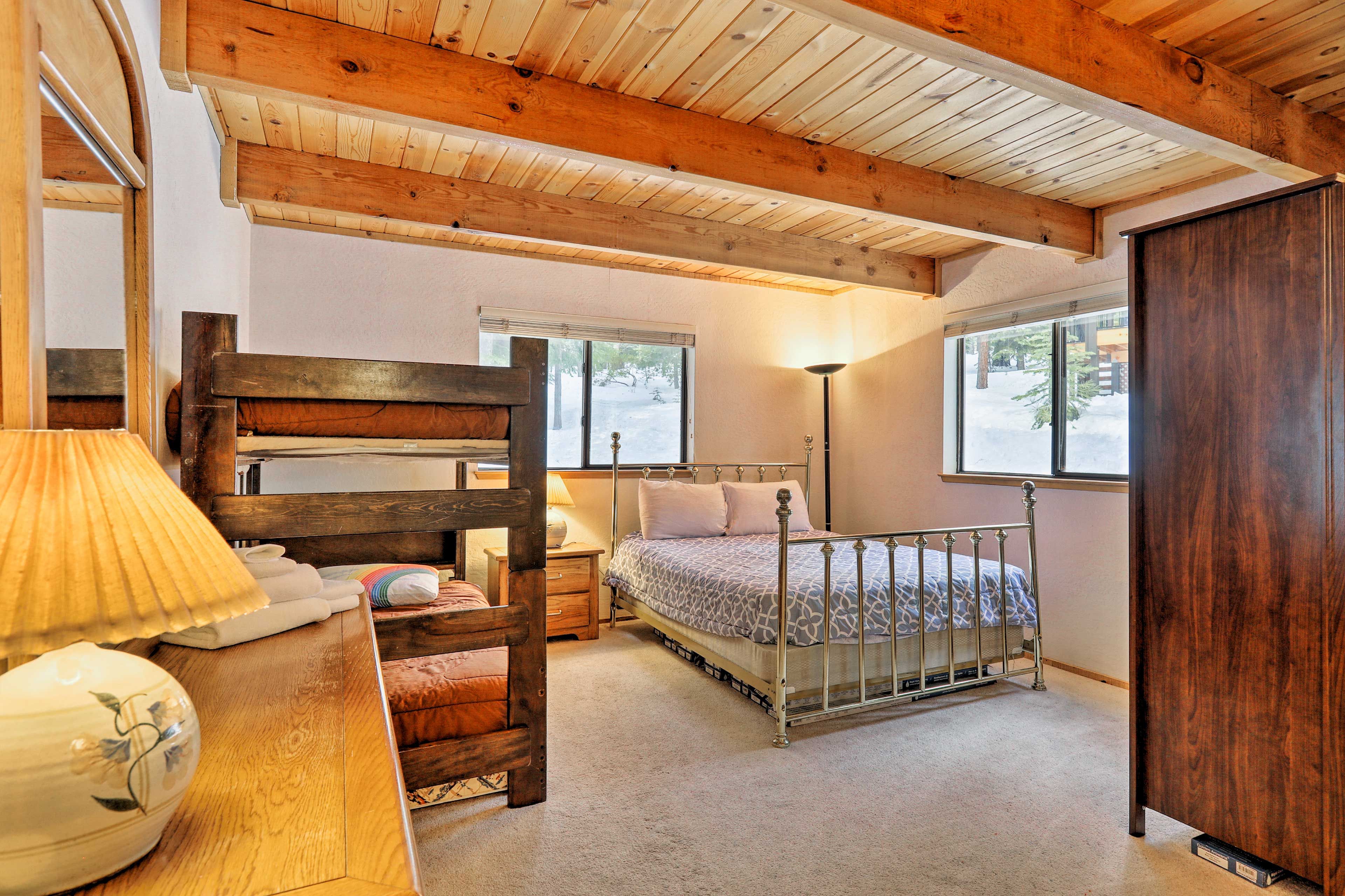 The main bedroom features a lofted twin-over-twin mattress and a queen bed.