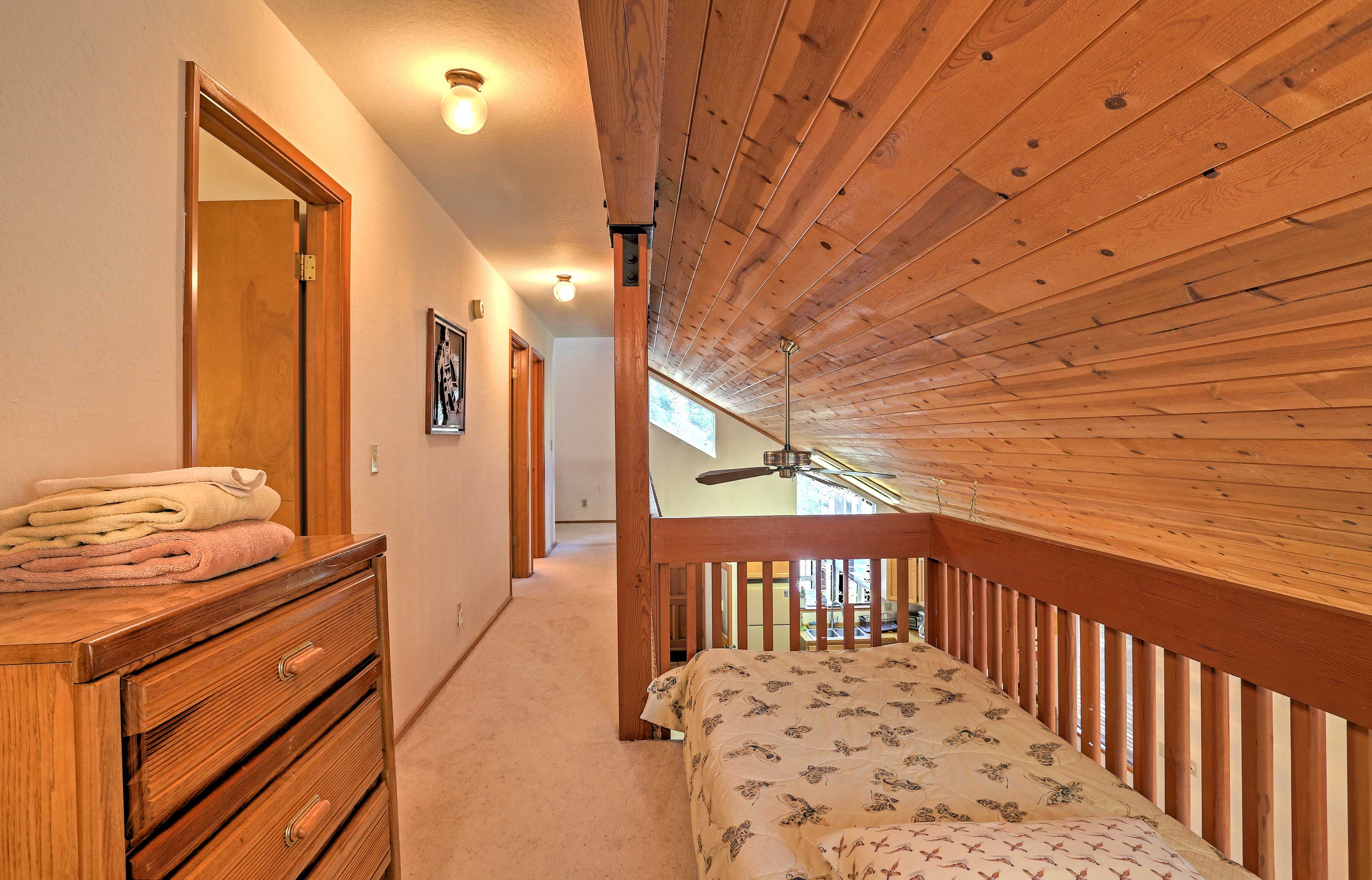 A twin bed in the reading nook upstairs provides additional sleeping for 1.