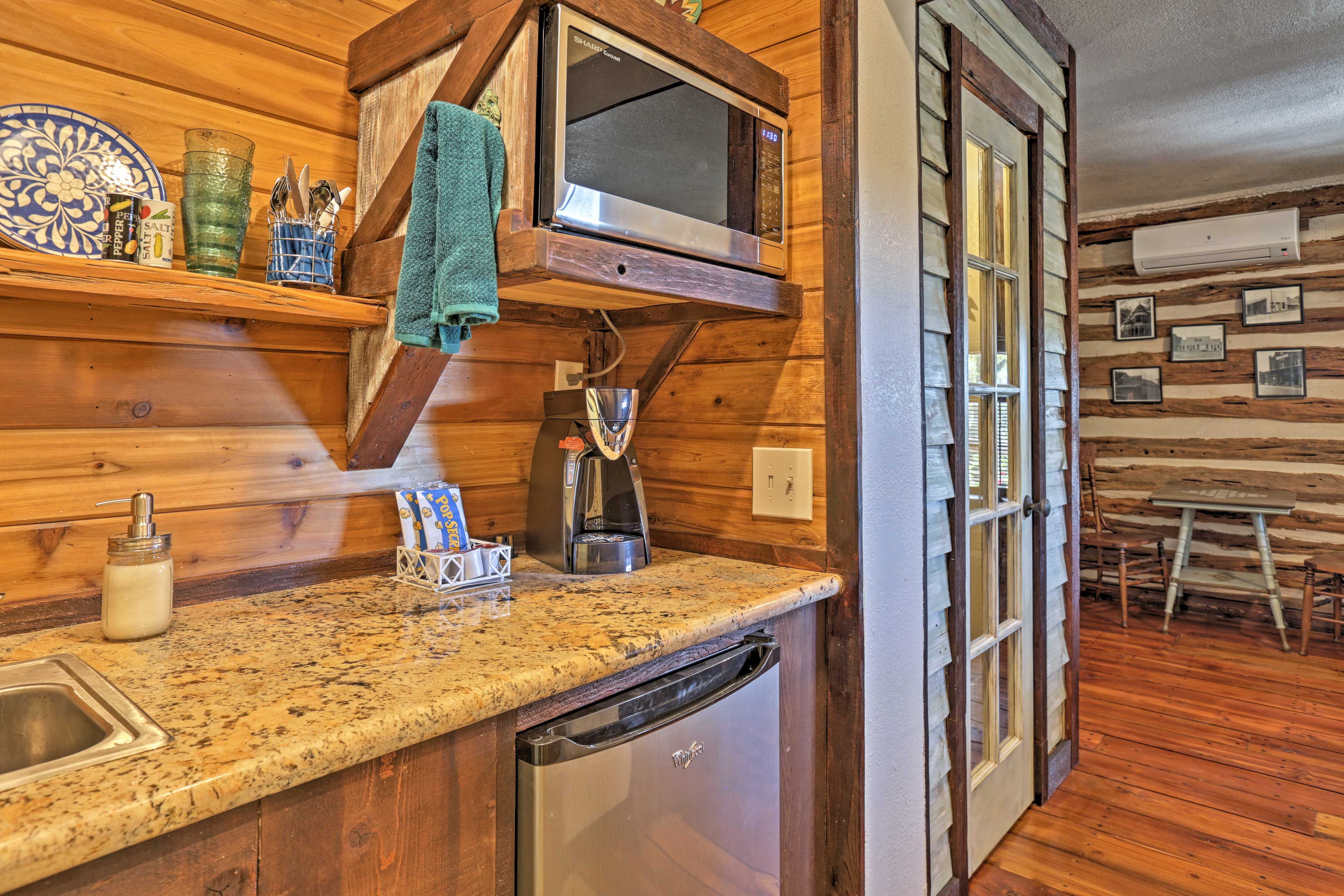 The kitchenette is equipped with stainless steel appliances.