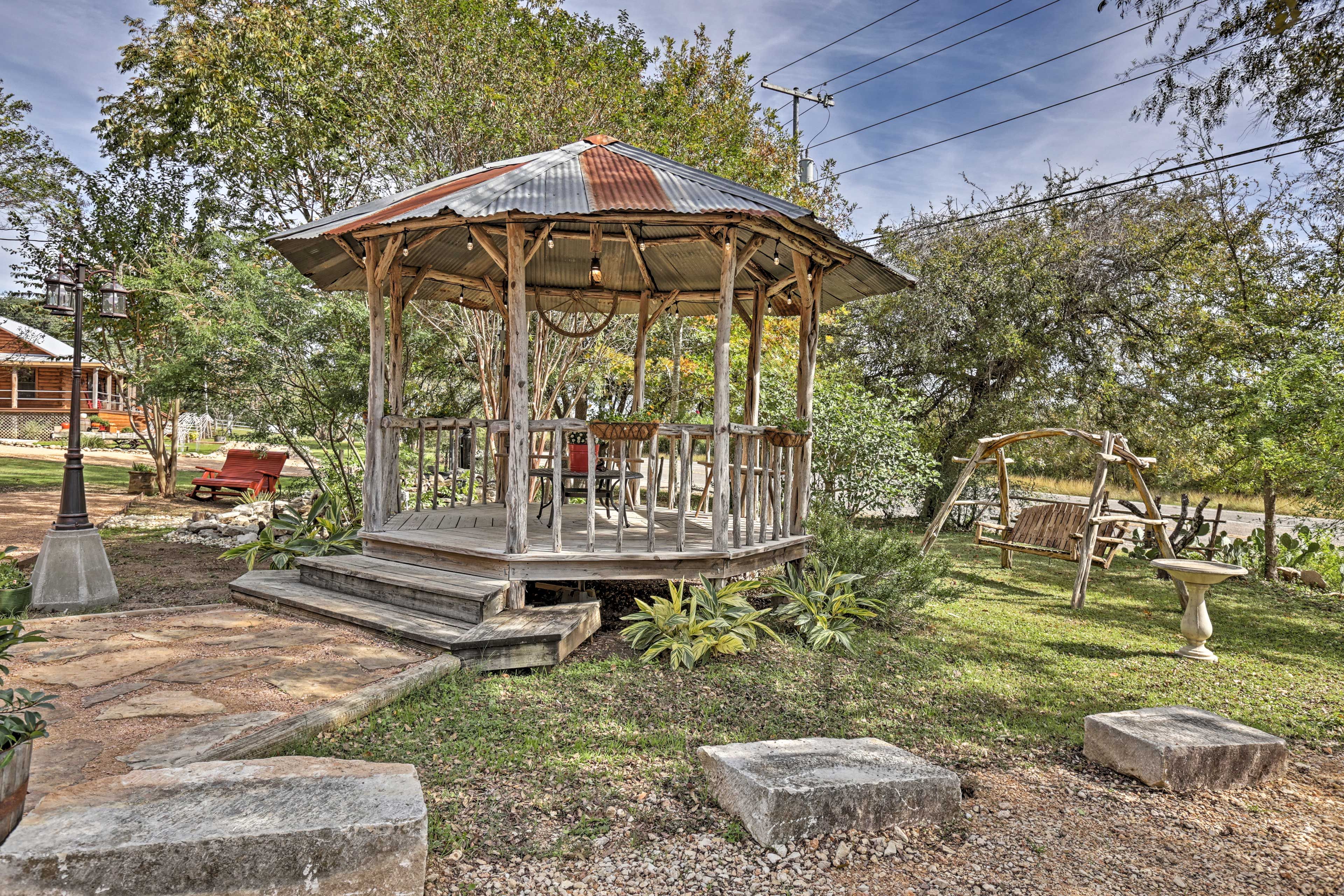 The gazebo creates a romantic, fairy tale atmosphere in the gardens.