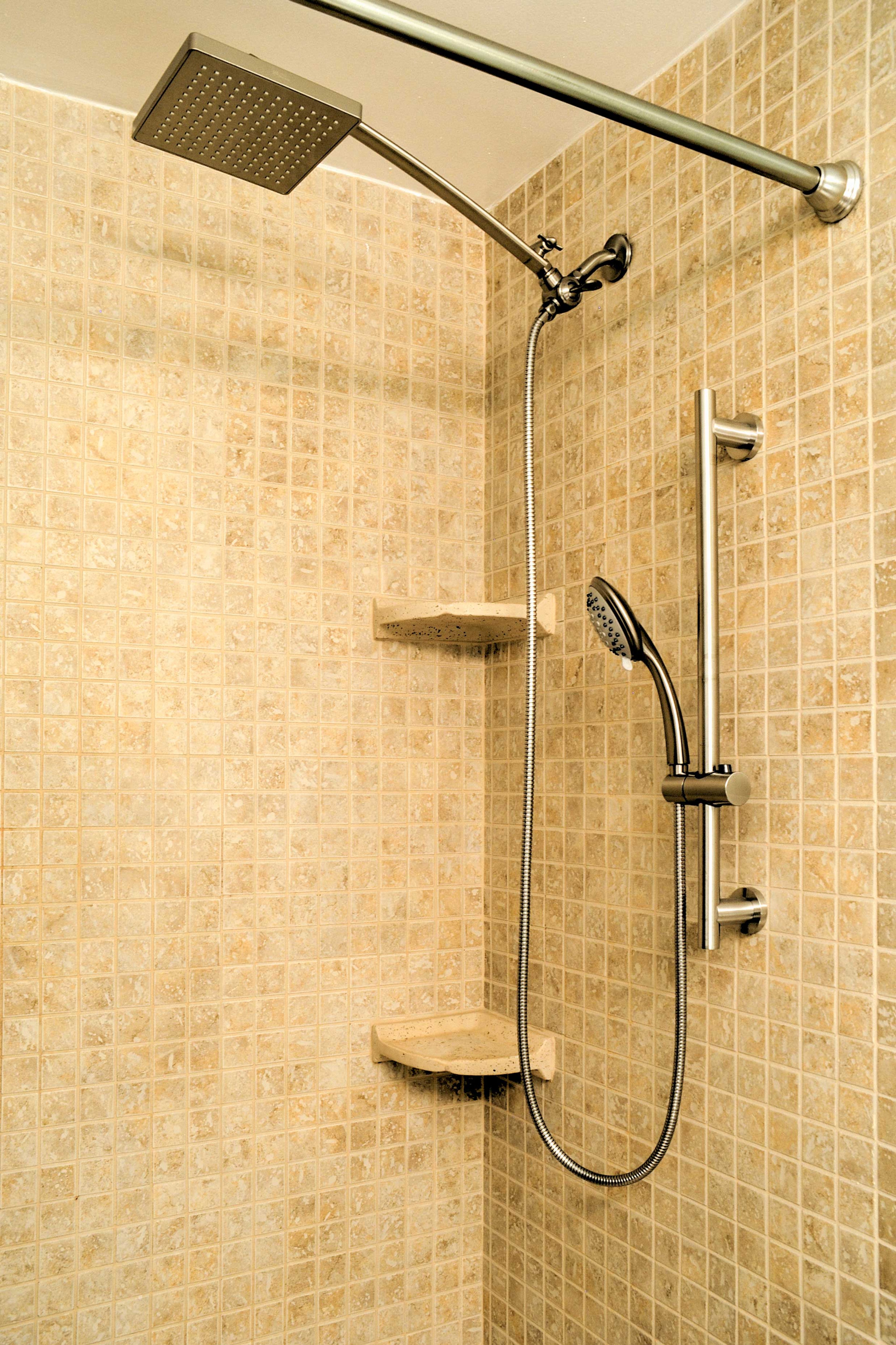 Use the handheld showerhead to rinse off the sand.