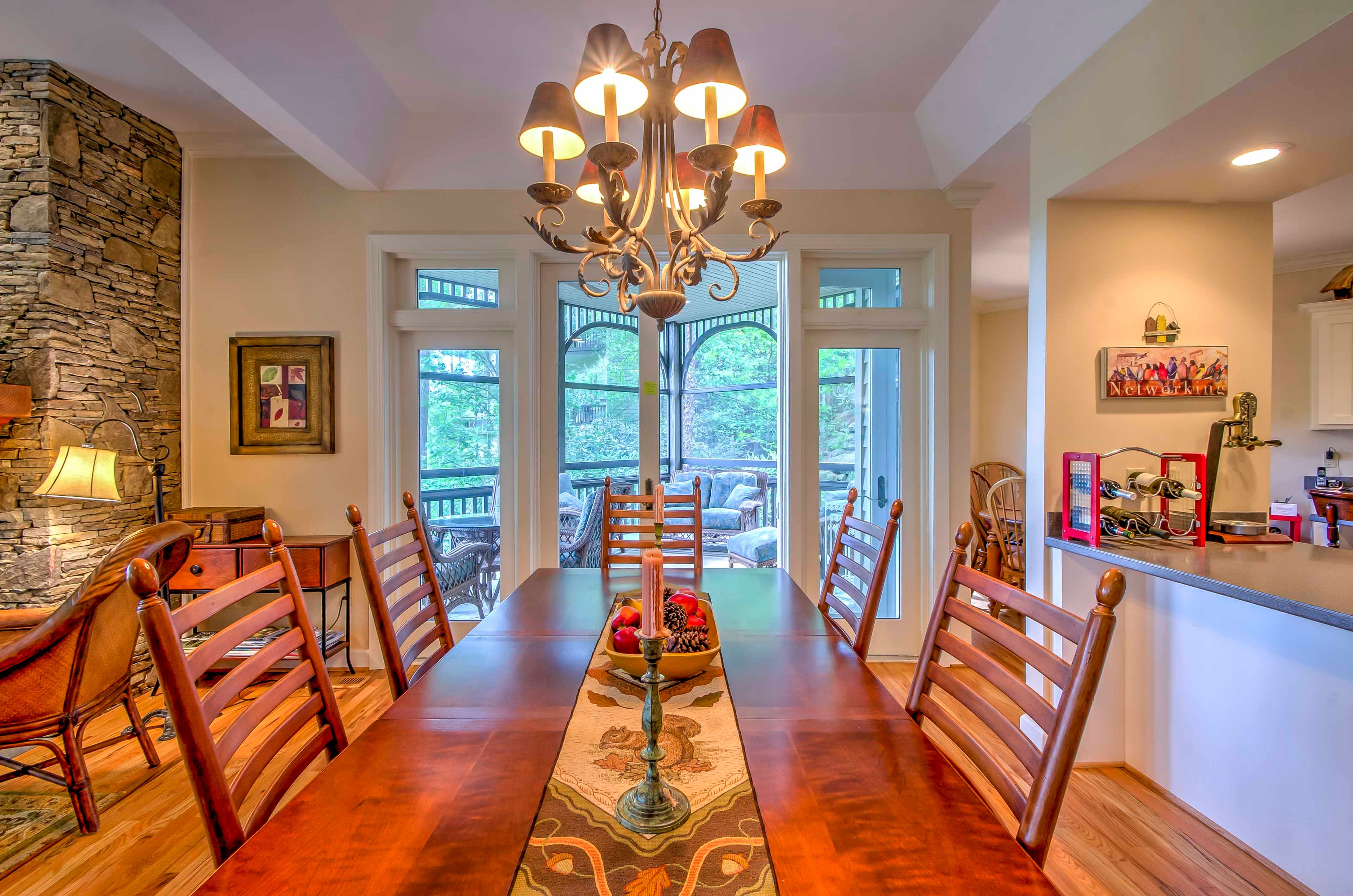 Gather around this formal dining table to enjoy your meals with the group.