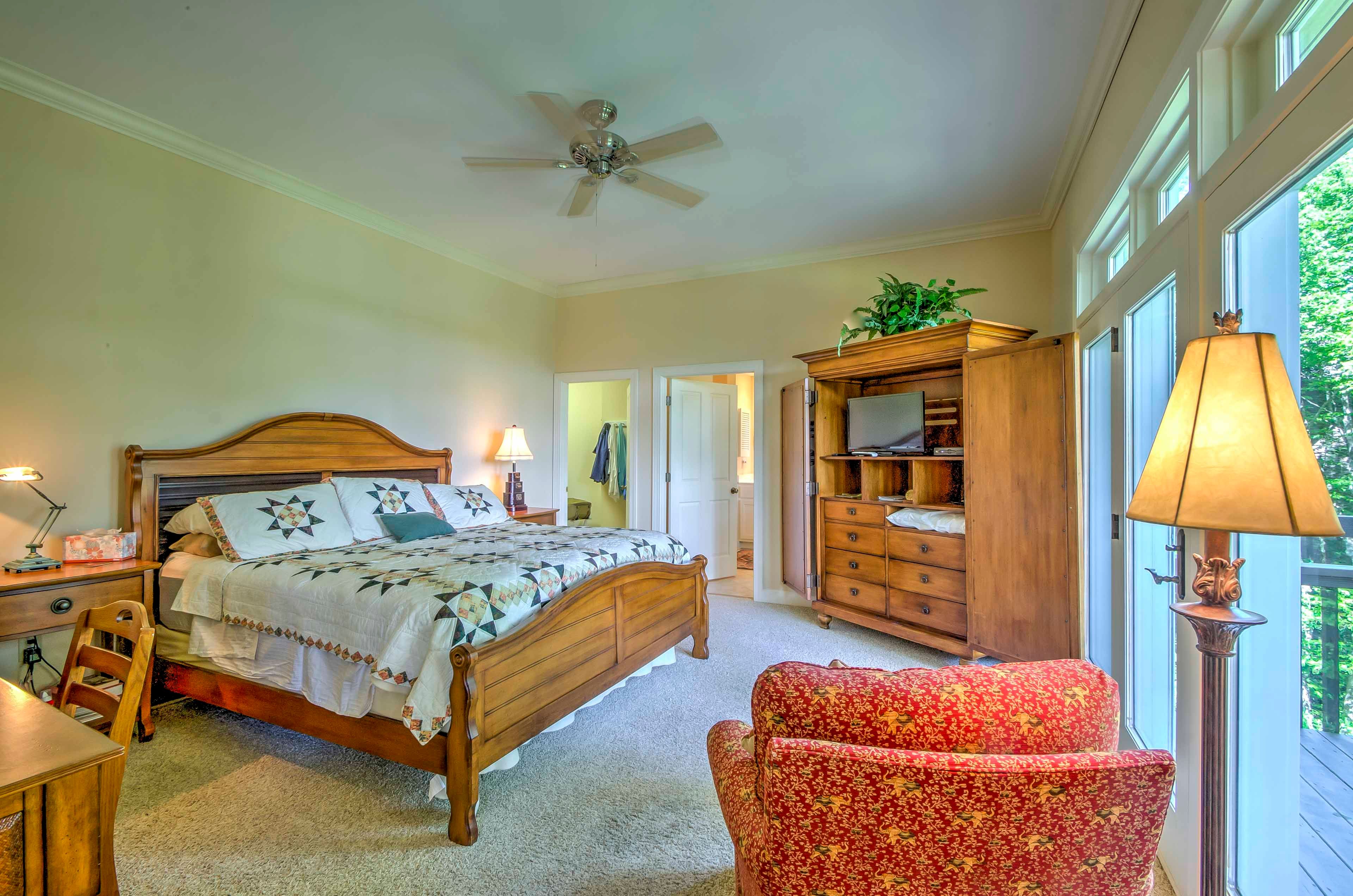 The first bedroom features a king-sized bed, en suite bathroom and balcony access.