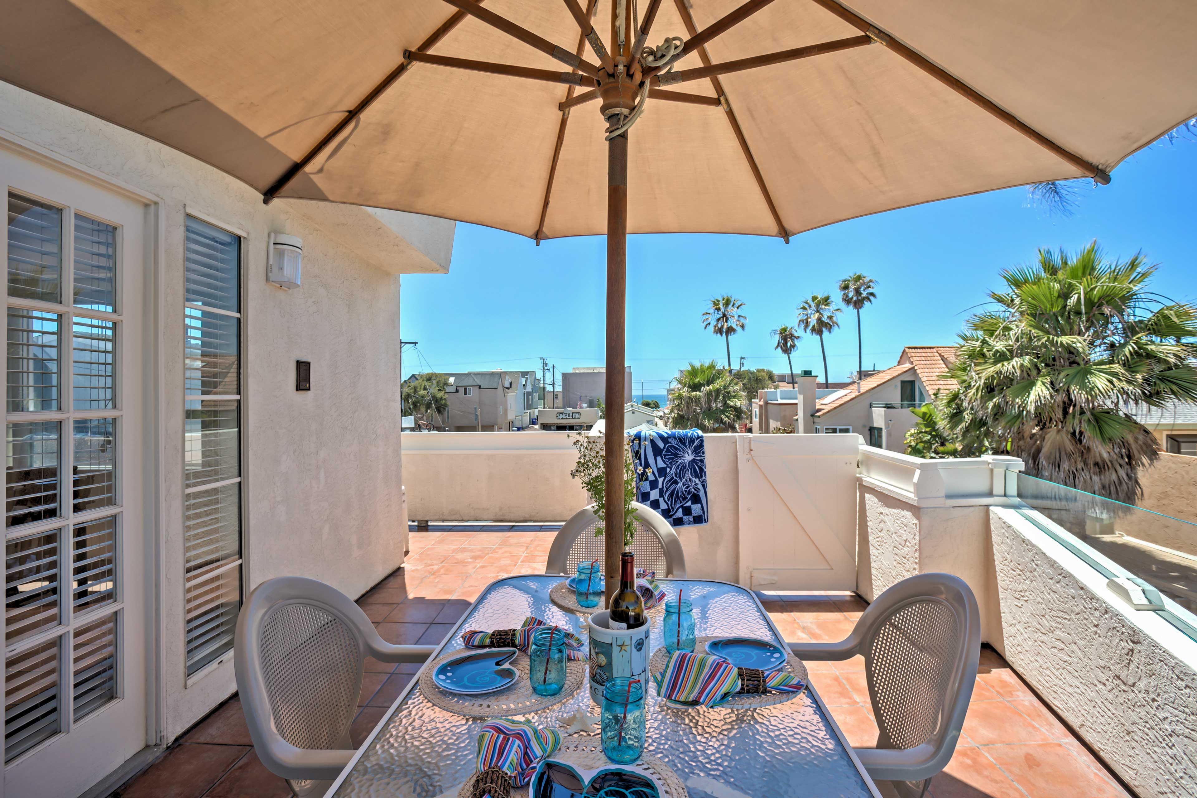 Sip morning coffee on the deck as you watch the waves crash against the sand.