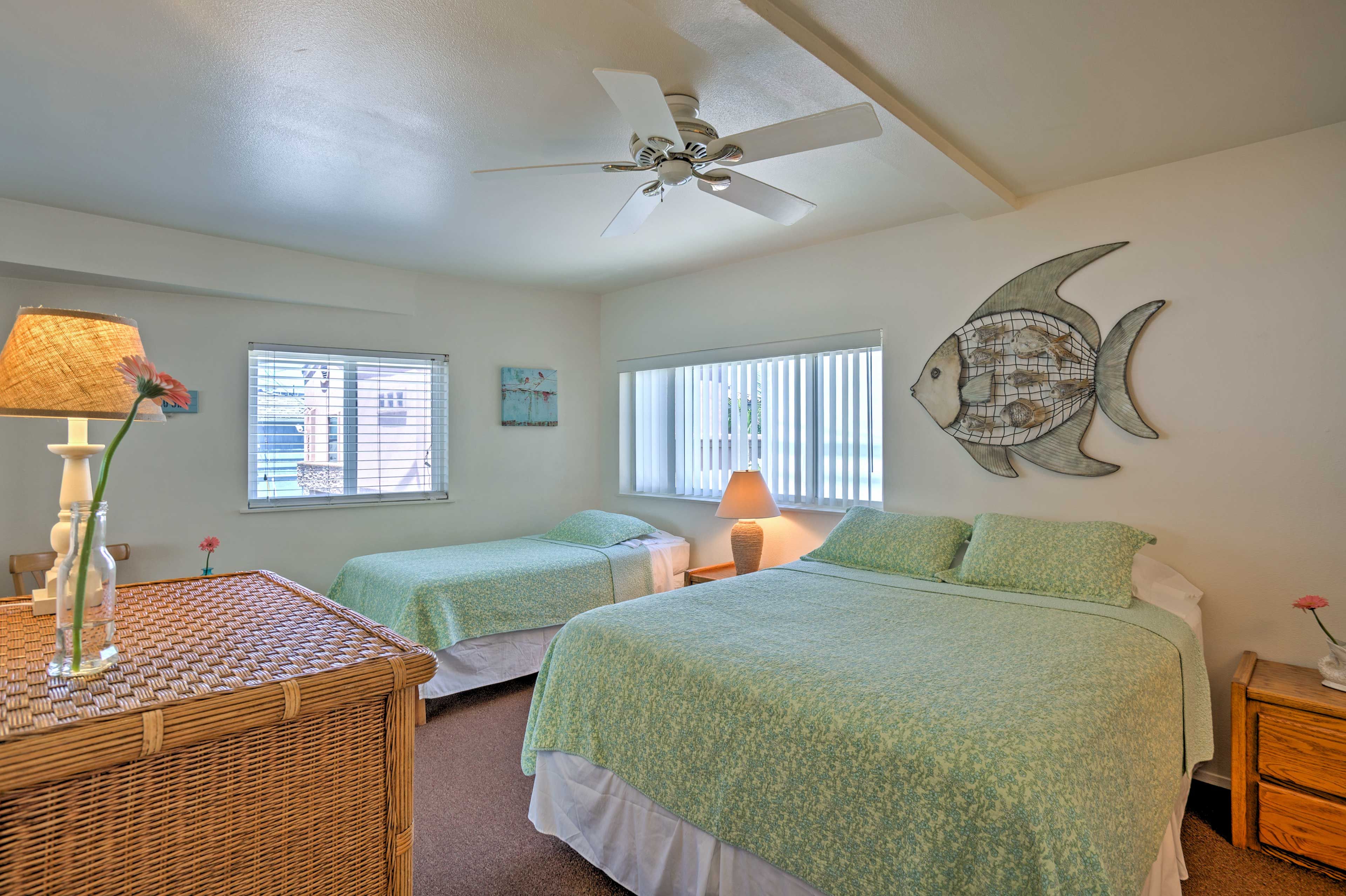 This bedroom features a queen and twin-sized bed.