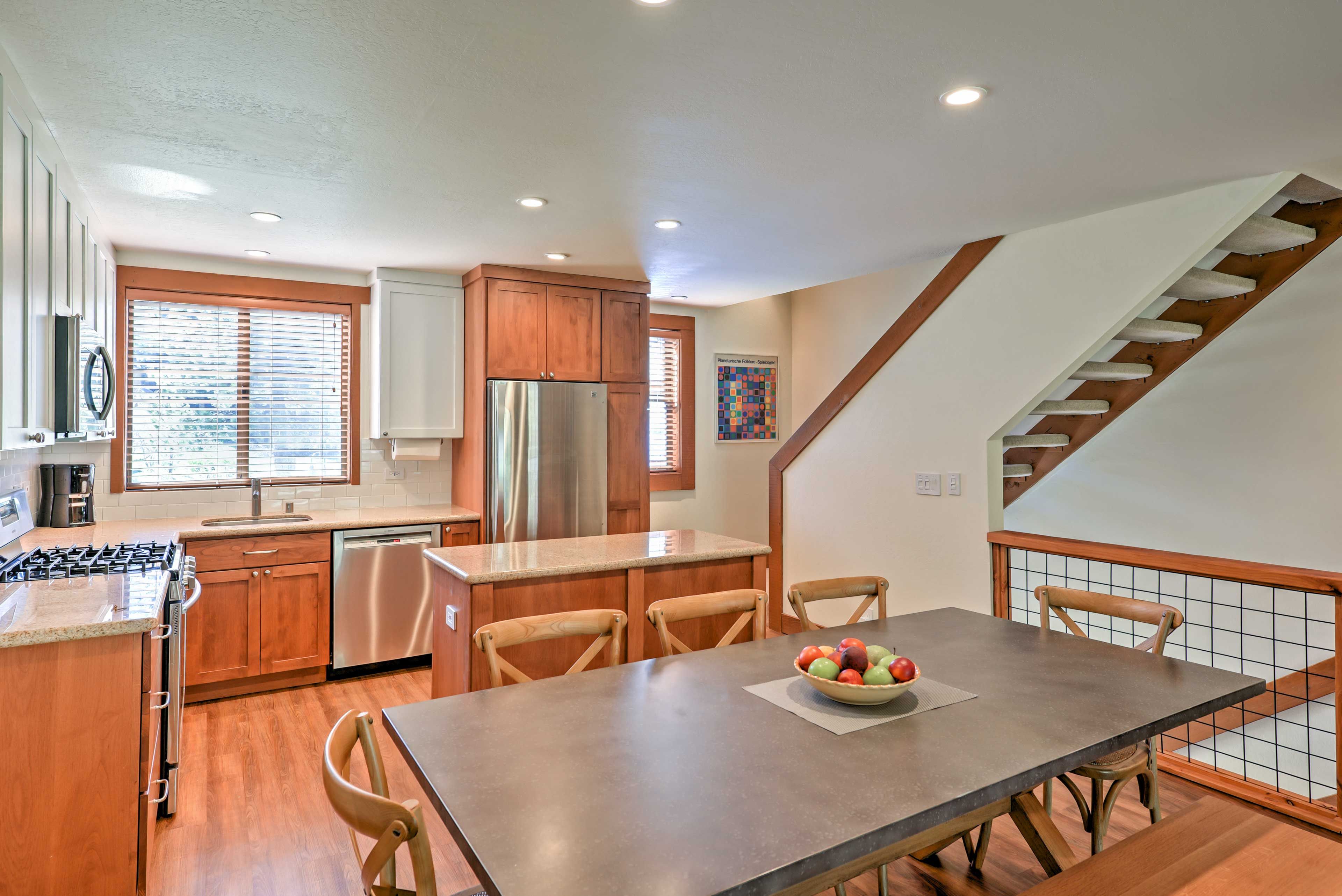 The kitchen comes complete with new stainless steel appliances.