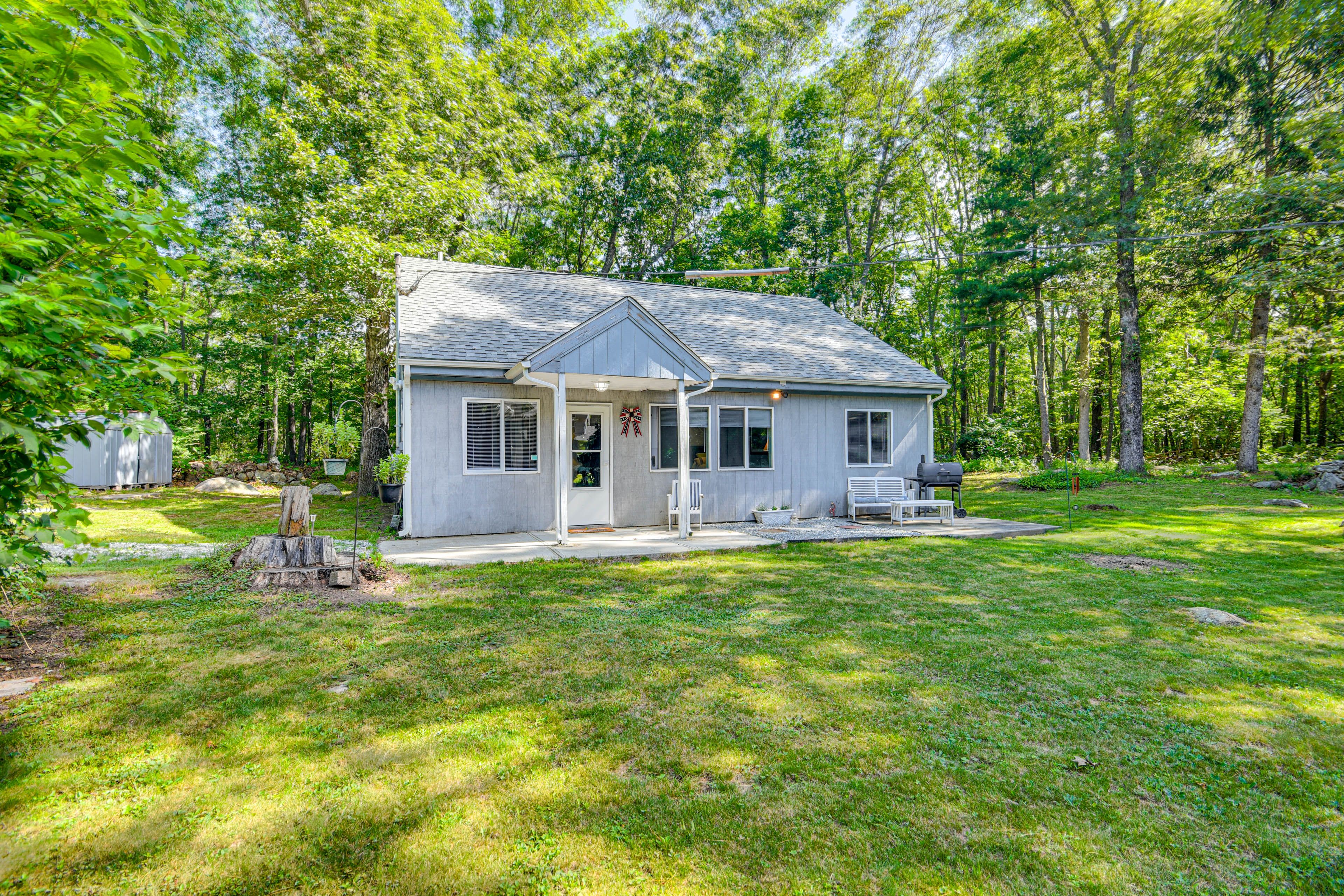 Property Exterior | Single-Story Cottage | Patio w/ Charcoal Grill