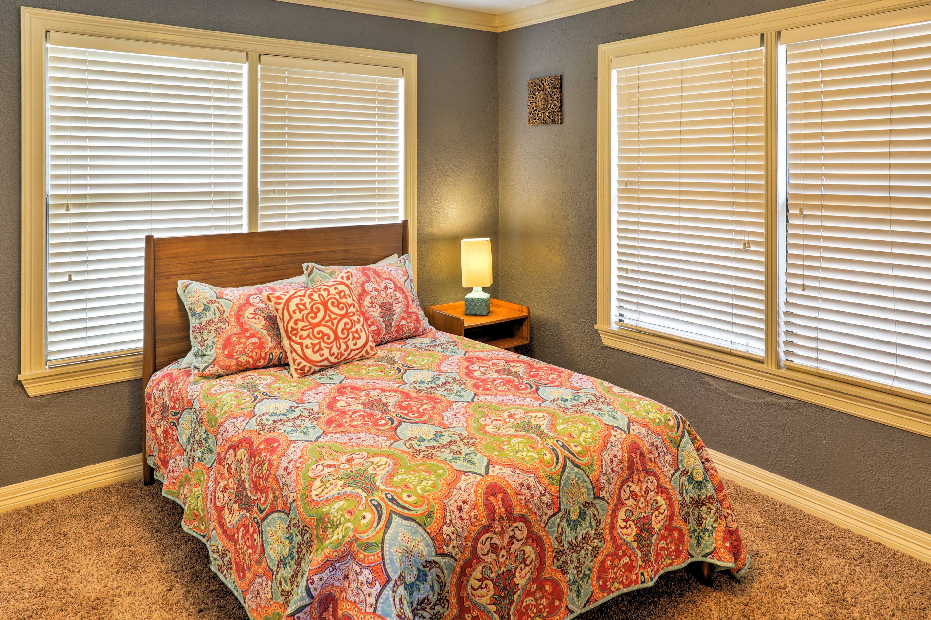 The full-sized bed in the second bedroom can accommodate up to 2 guests.